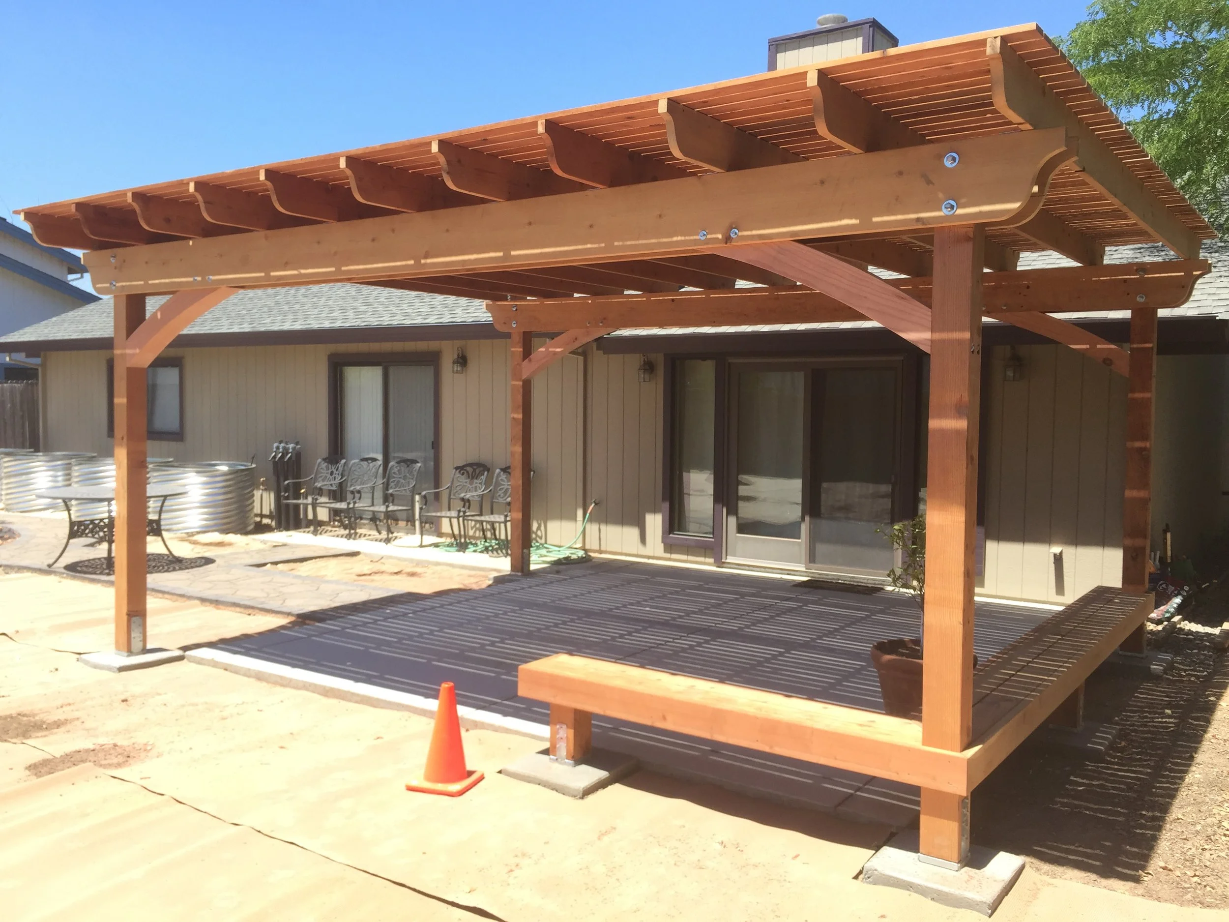  Custom redwood pergola with built-in bench. 