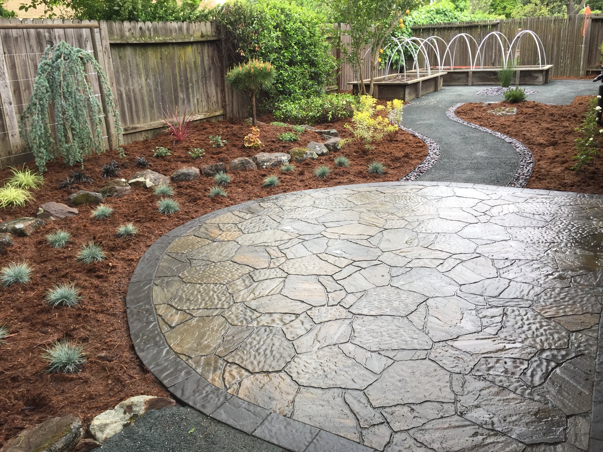  New paver patio, pathway, moss rock, plantings, irrigation and mulch. 