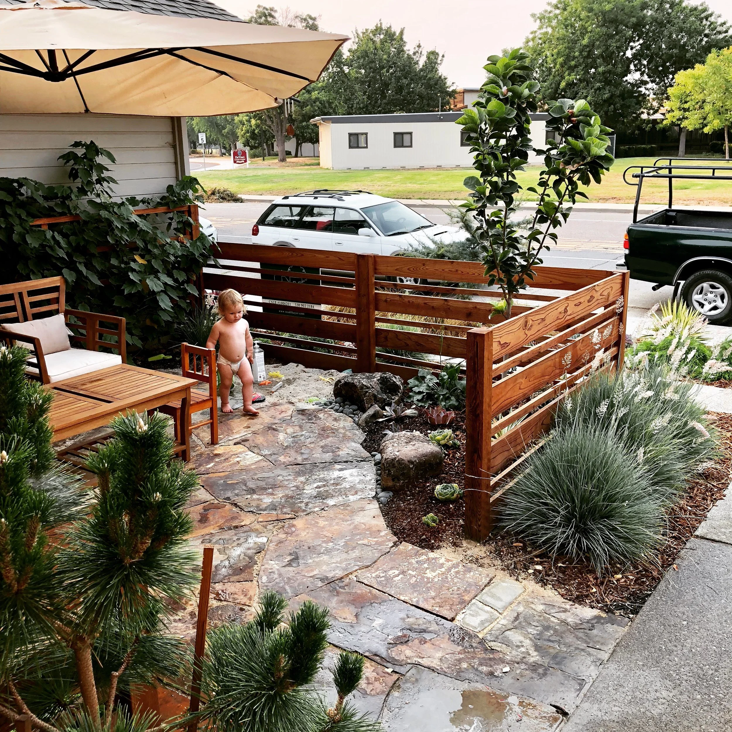  Frontyard remodel, including fencing, flagstone and plantings. 
