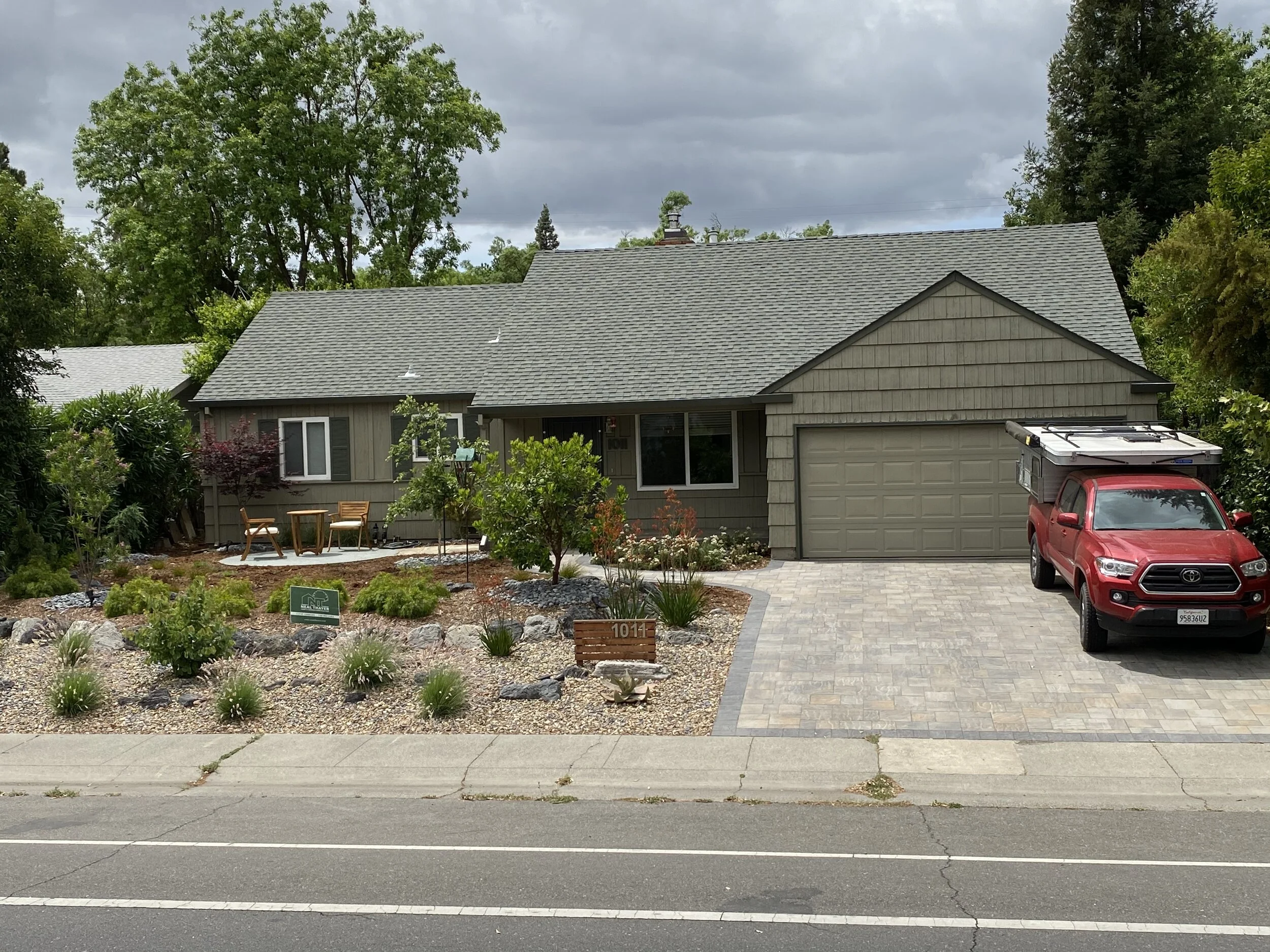  Front yard remodel, including driveway, path, patio, plantings, irrigation, boulders, cobble and mulch. 
