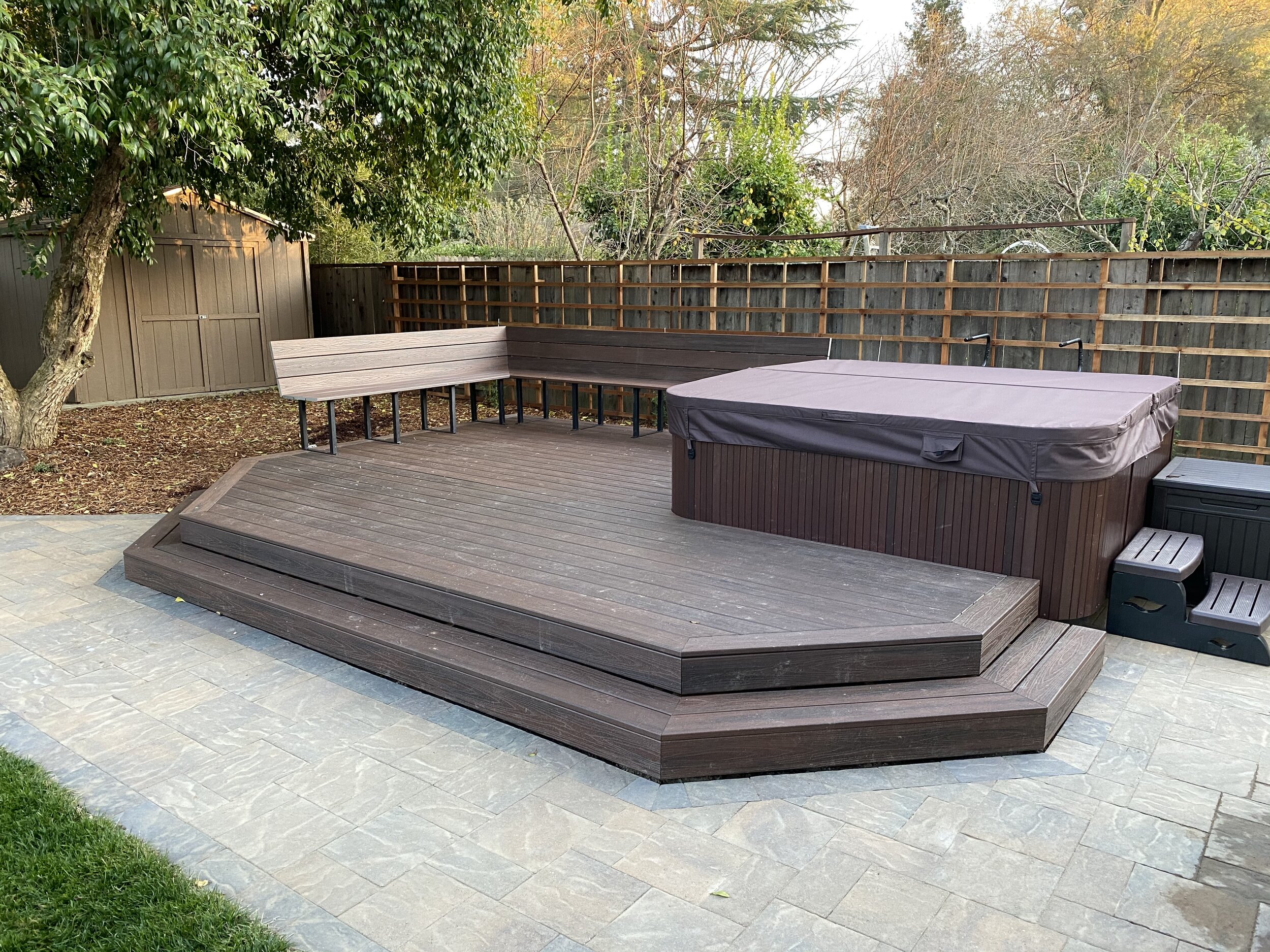  New hot tub, Trex deck and bench, and pavers. 