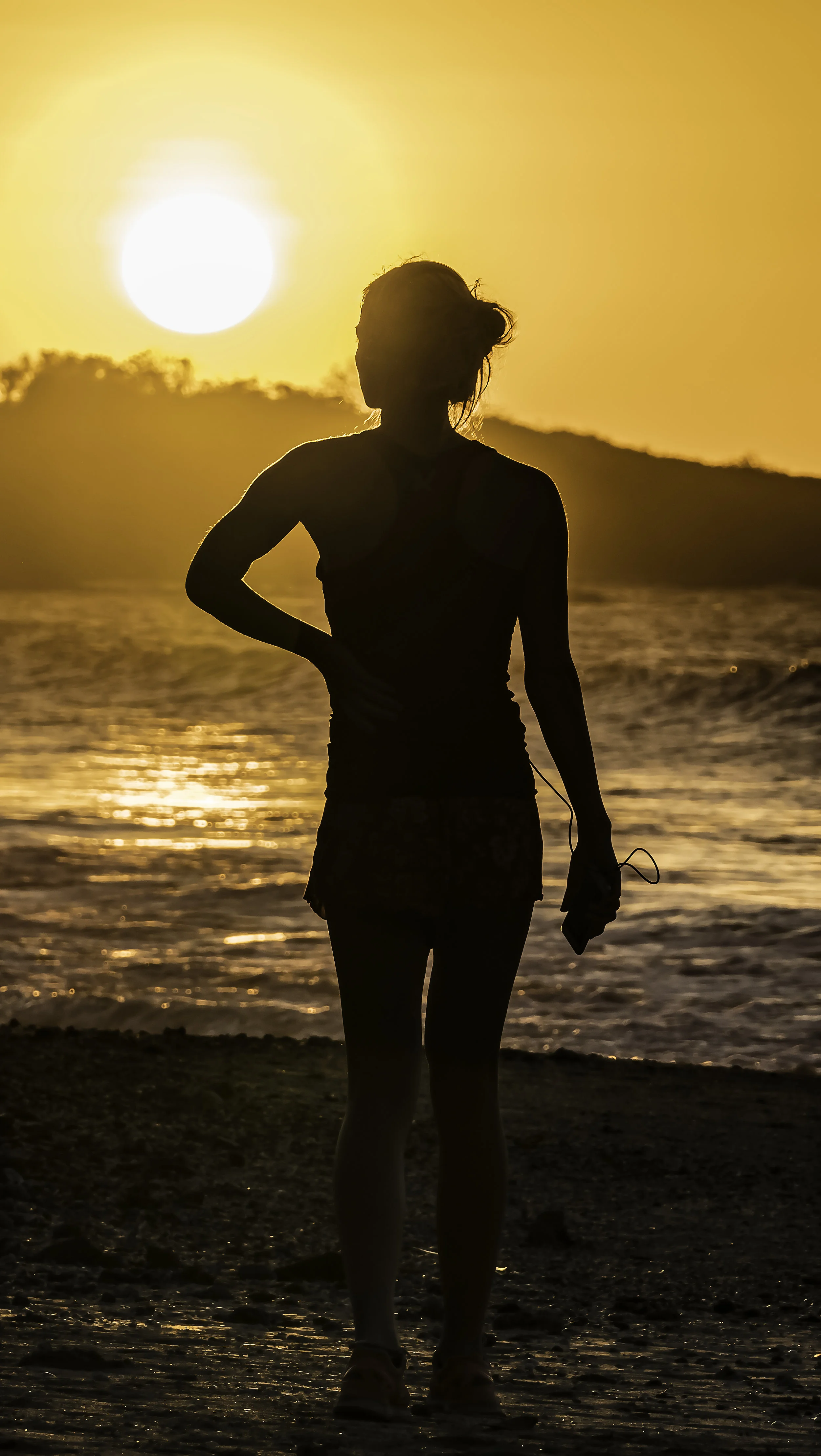 Woman watching Sunset on Tamarindo Beach, CR