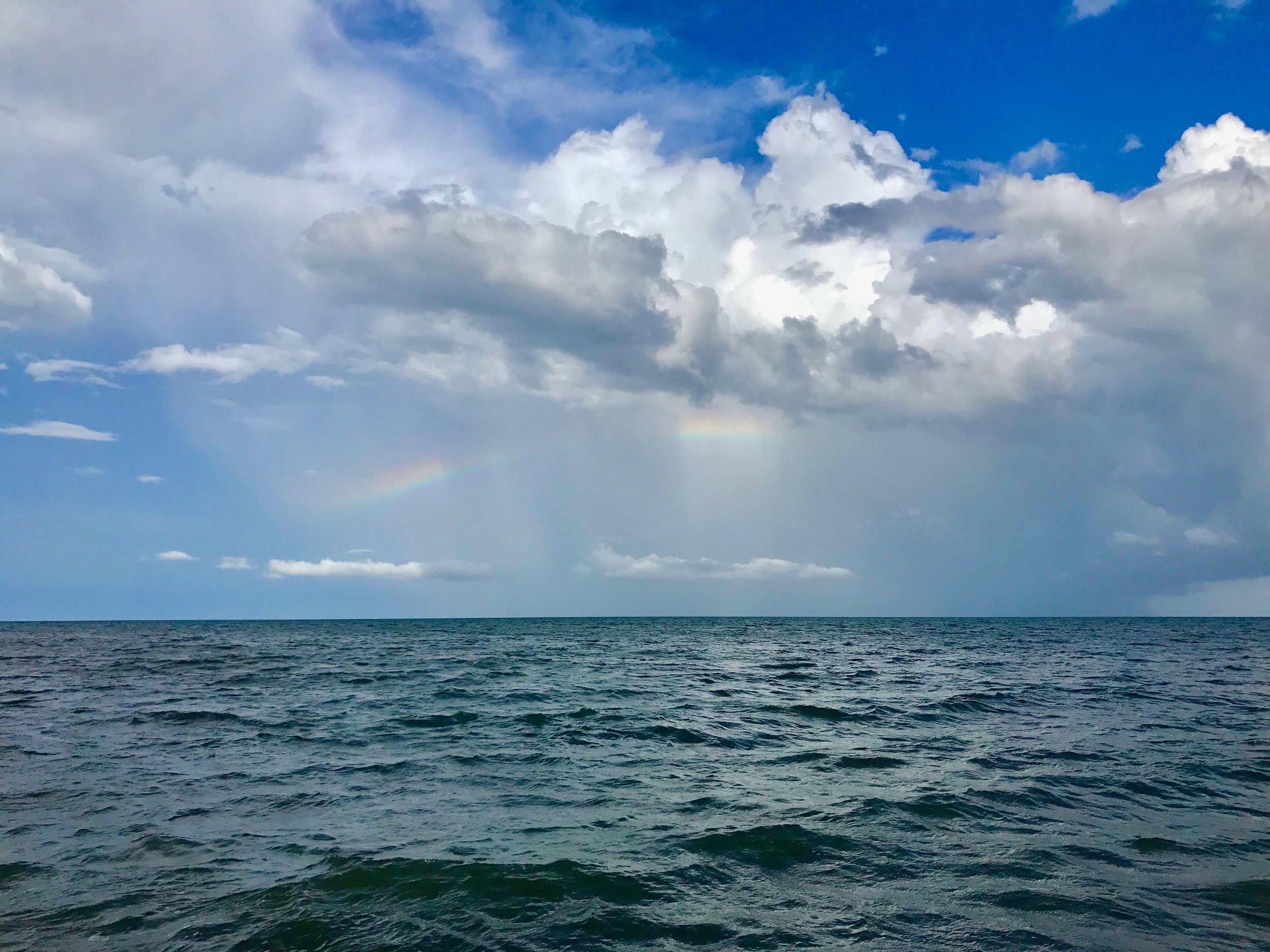 Lots of rain has its plusses - a rainbow over the Gulf of Honduras