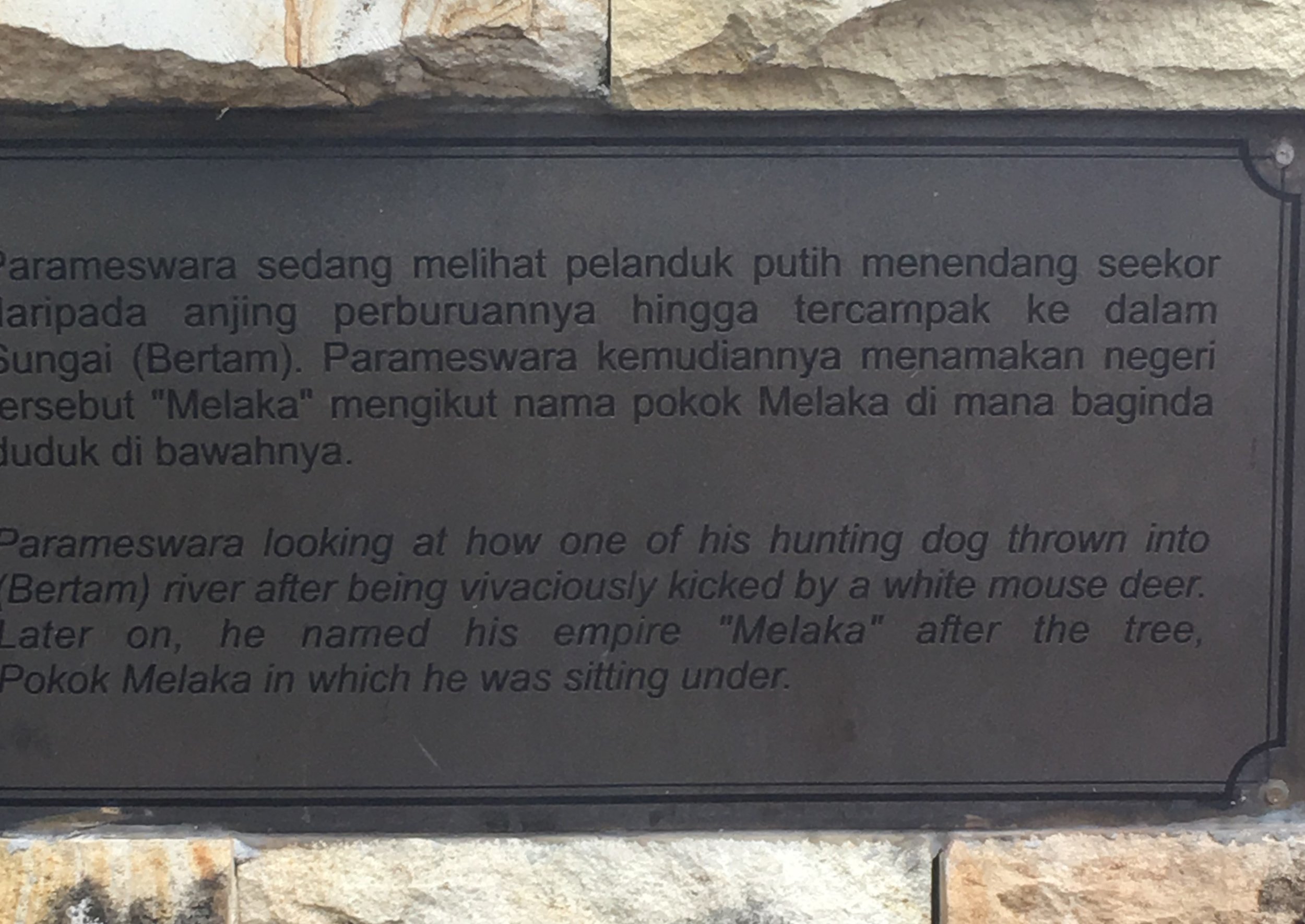 A plaque by the site of the malacca tree.