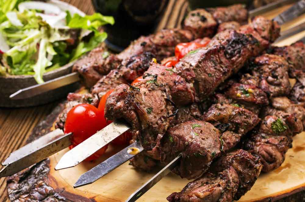 Souvlaki a popular Greek fast food consisting of small pieces of meat grilled on a skewer