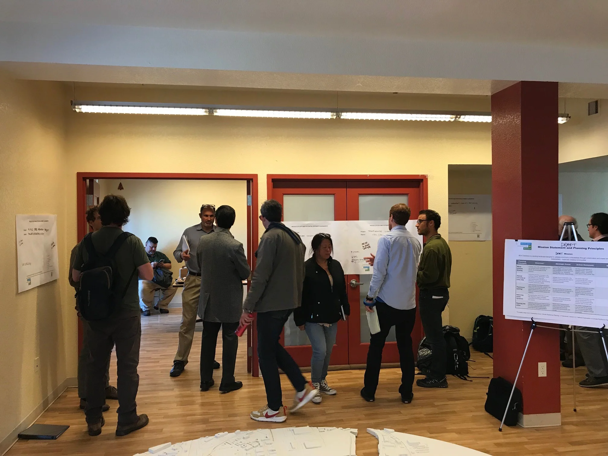 Representatives from government agencies, non-profits, and local community organizations discuss each other’s projects and identify opportunities for collaboration