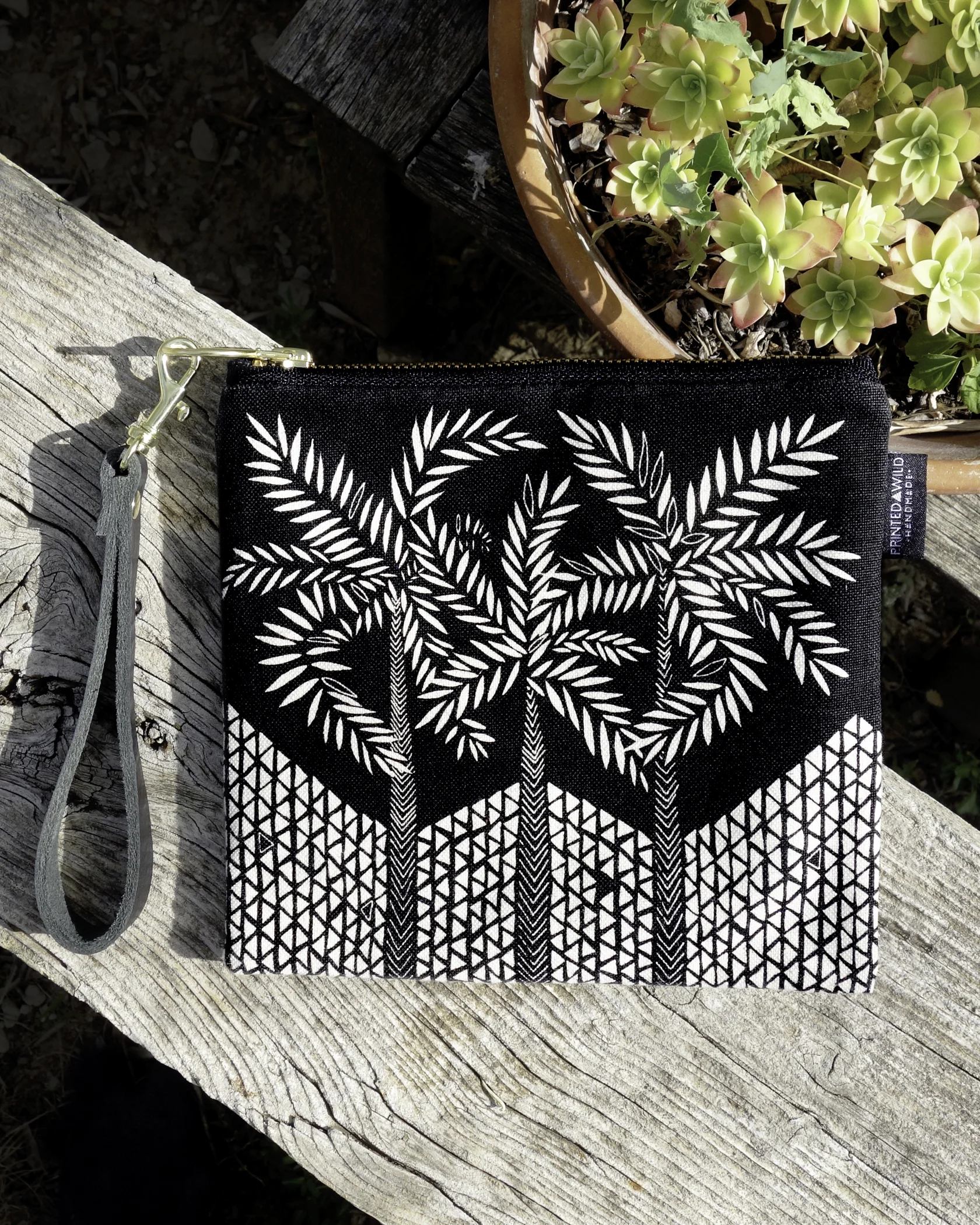 Printed Wild Square Clutch with black and white screen-printed plant pattern handmade in Washington, D.C with certified organic material