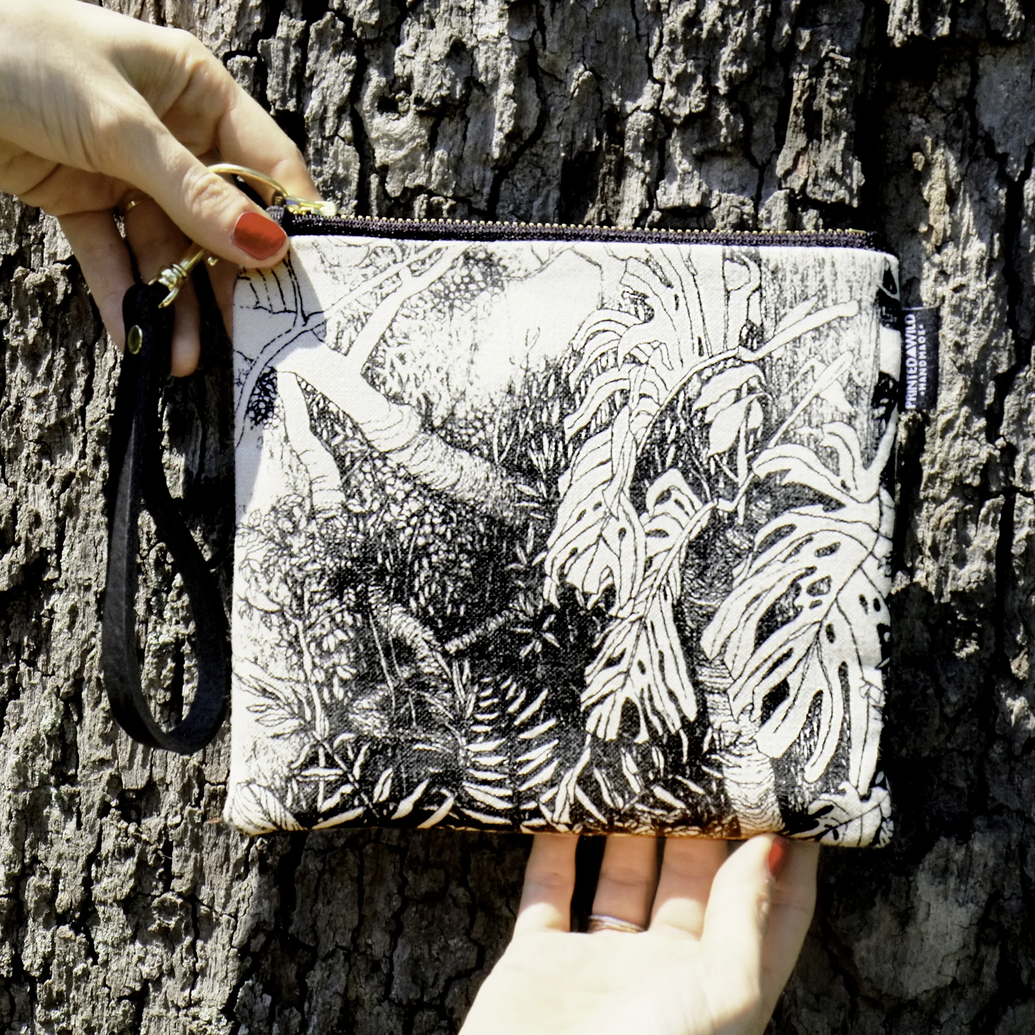 Printed Wild Square Clutch with black and white screen-printed plant pattern handmade in Washington, D.C with certified organic material