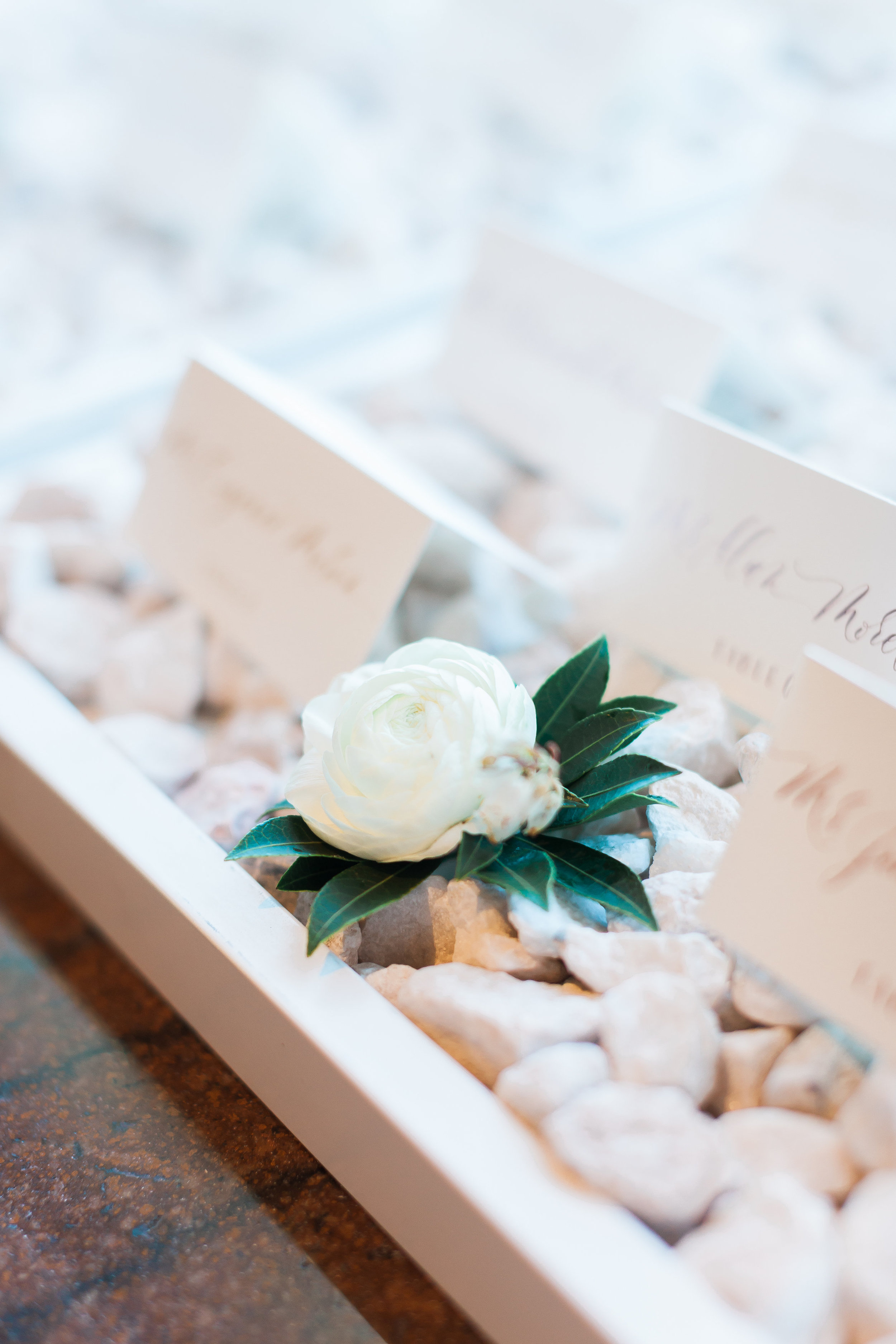 Escort card display for an all white wedding by Layers of Lovely 