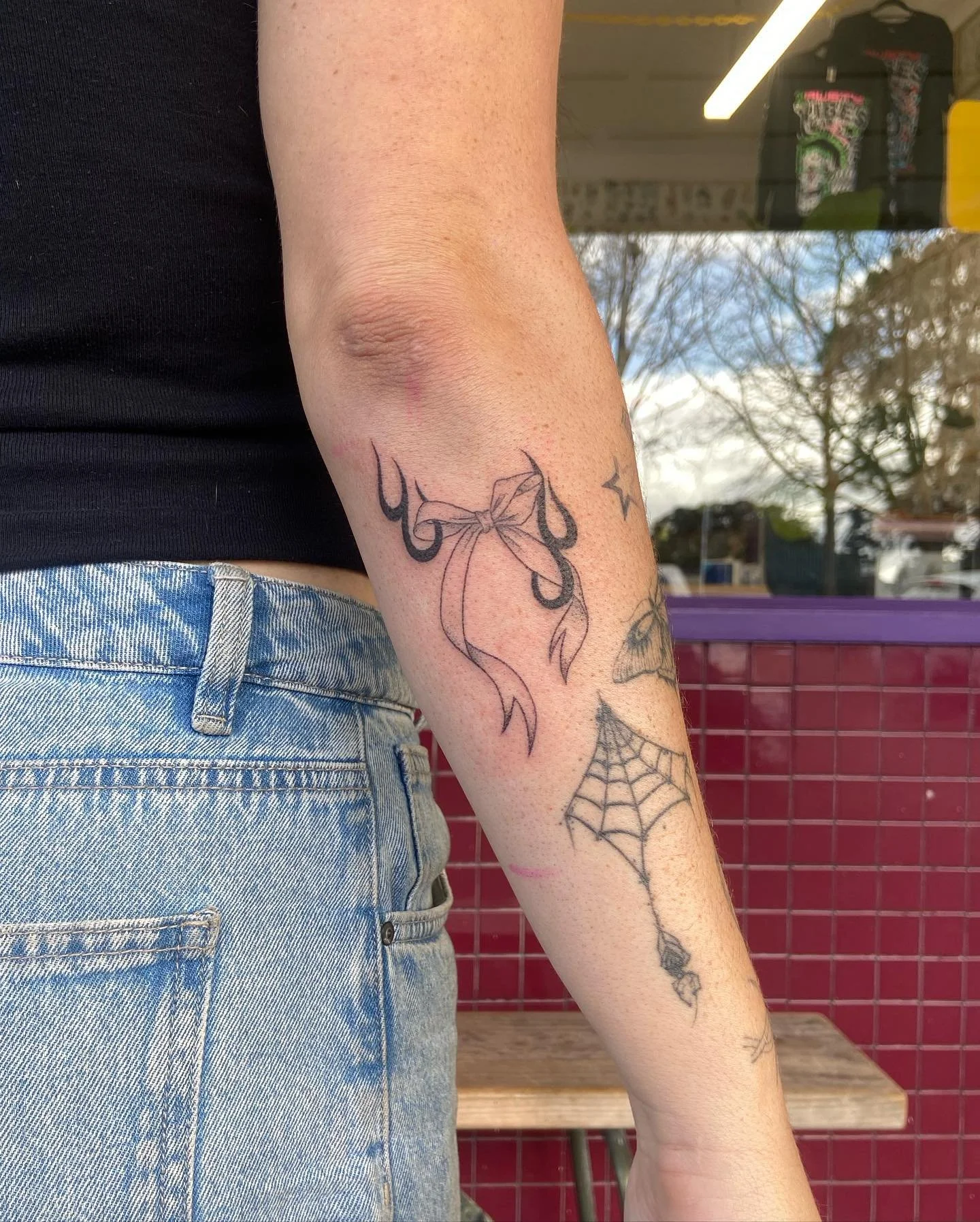 We ❤️ a bow and flame combo! Hand poked for Chloe the other day, always a treat to see ya doll! Get in touch for ya next tattoo