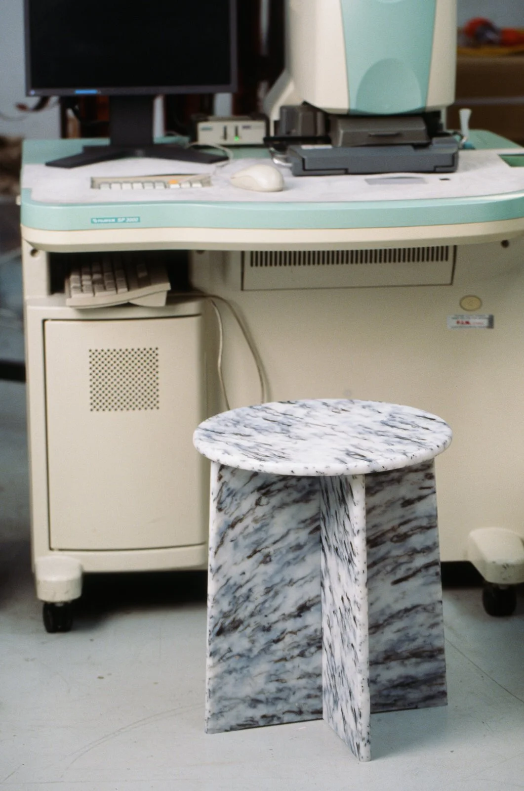 No.1875 recycled film stool displayed beside photographic printing equipment