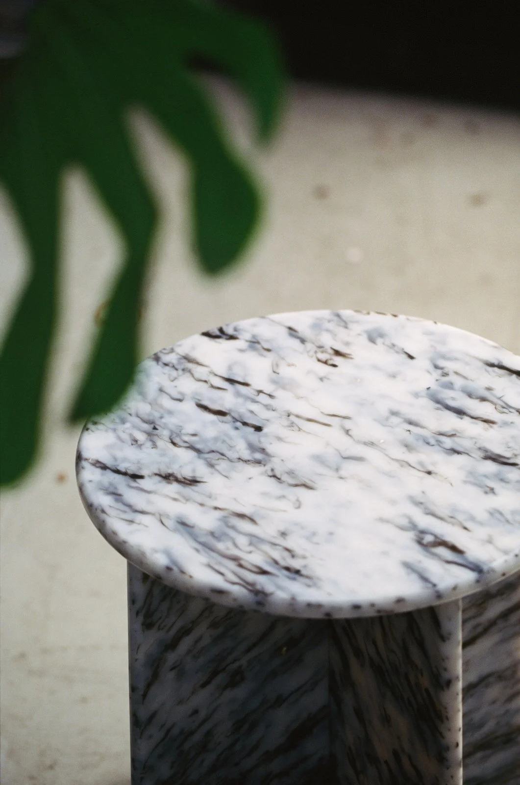 Close-up of the No.1875 stool and side table made from recycled Kodak and Ilford film containers