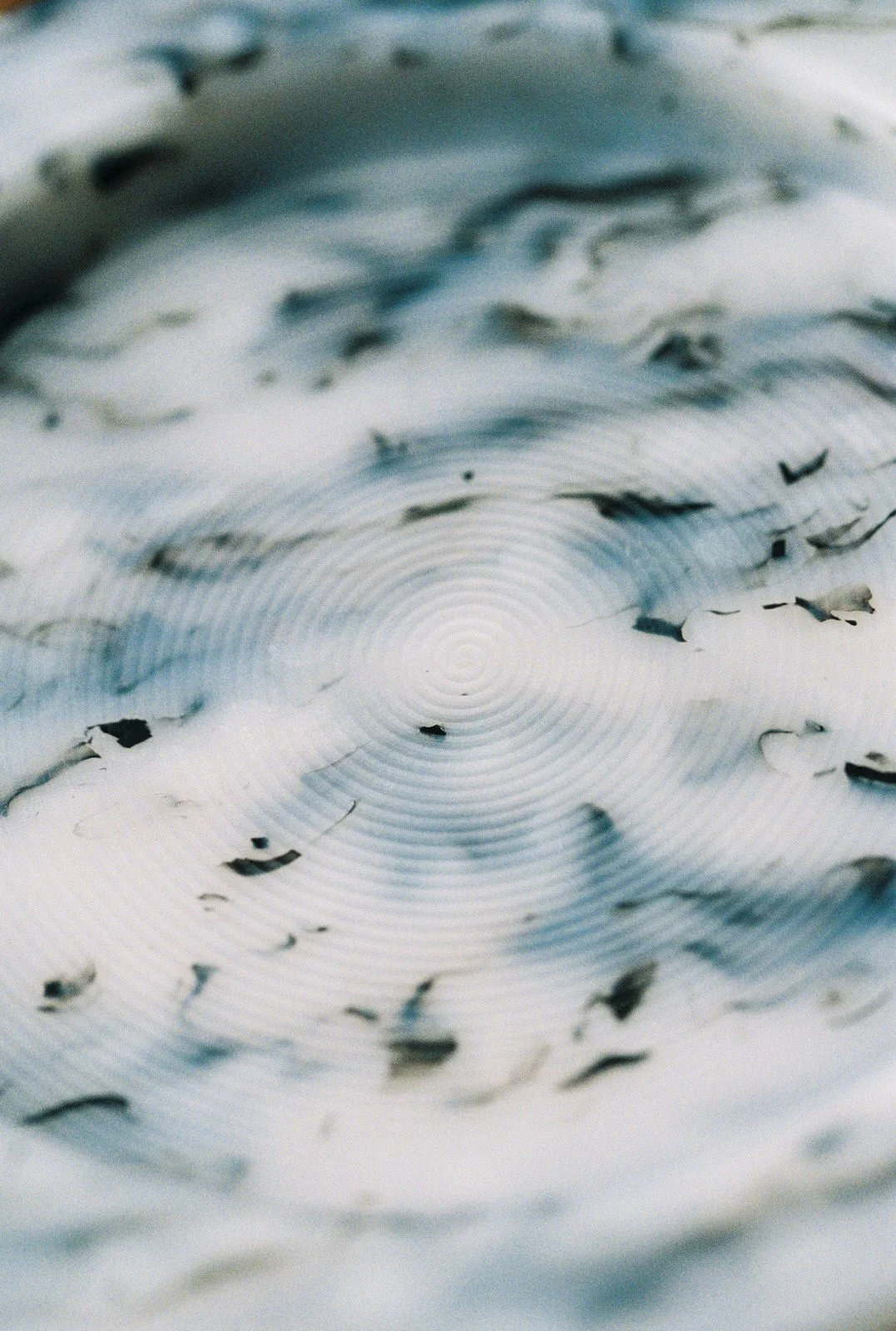 Close-up of the unique marbled pattern in the recycled film tray