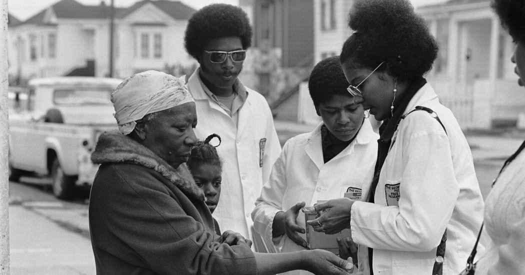 Photo by Stephen Shames (Like the men toting guns, these men and women are also members of the Black Panther Party. The contrast is striking. I love it).
