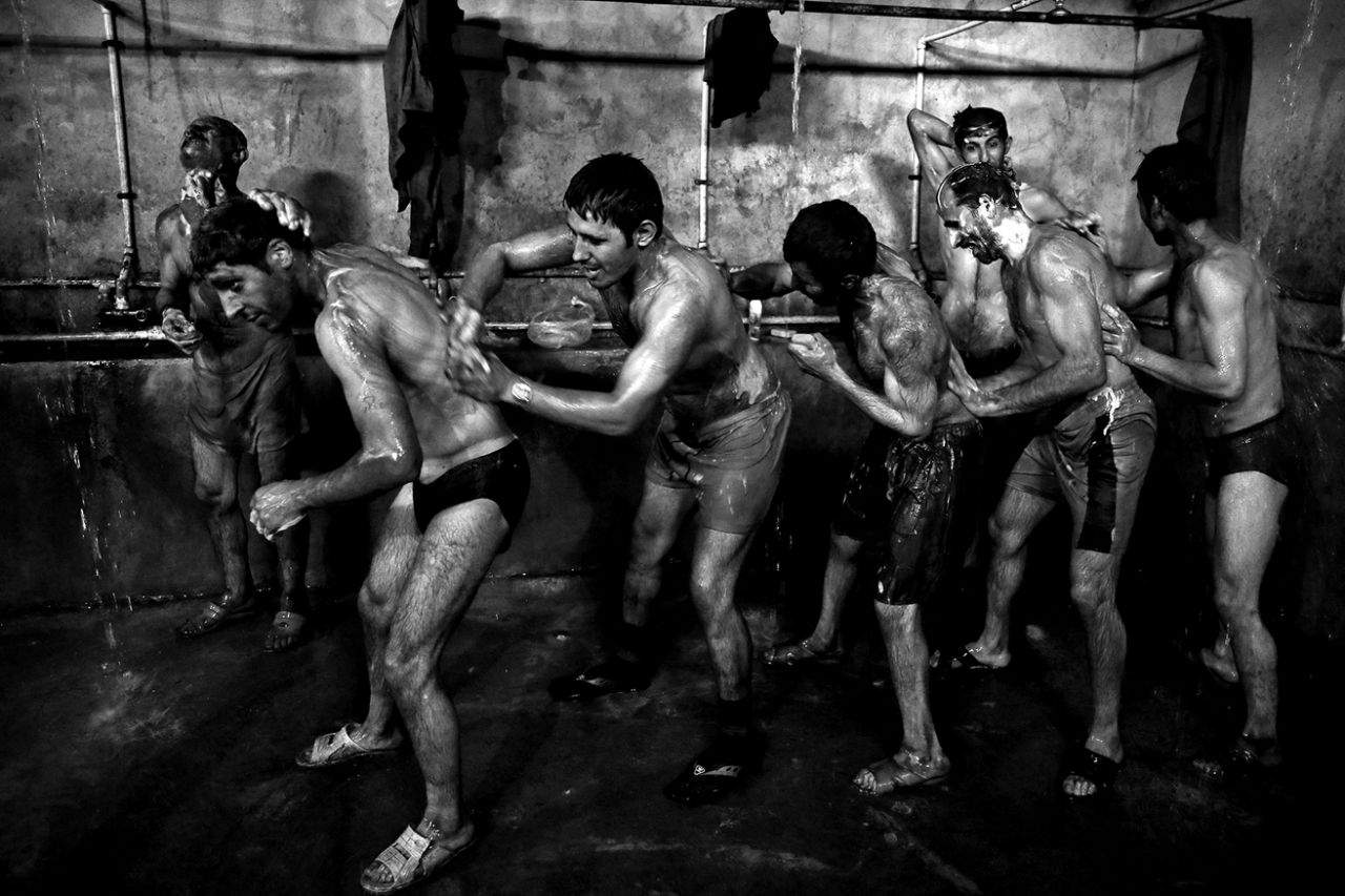 Iranian coal miners shower after a long day of work at a mine near the city of Zirab 132 miles northeast of the capital Tehran on a mountain in Mazandaran province, Iran on May 6, 2014. (Photo: Ebrahim Noroozi/AP)