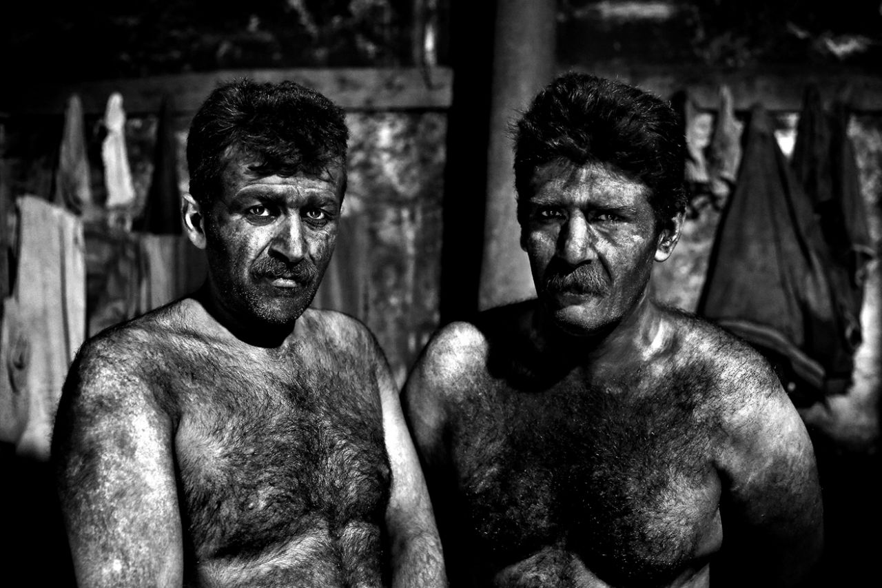 Iranian coal miners pose for a photograph before taking a shower after a long day of work at a mine near the city of Zirab 132 miles northeast of the capital Tehran on a mountain in Mazandaran province, Iran, May 7, 2014. (Photo: Ebrahim Noroozi/AP)