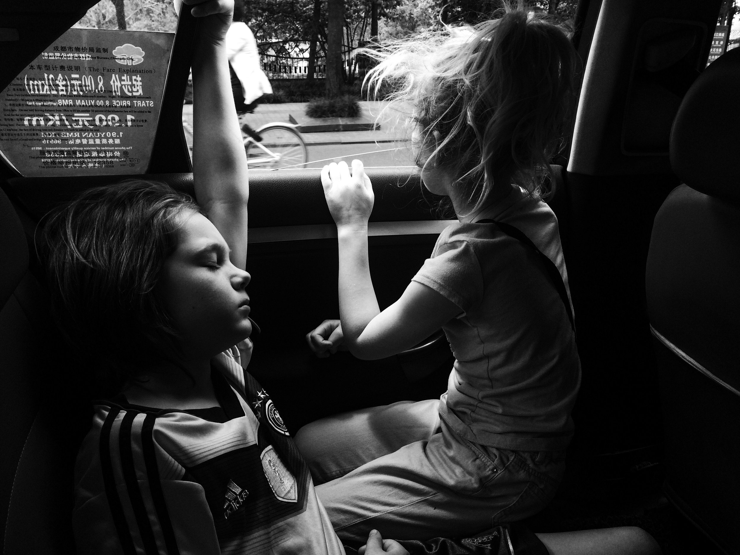 Taxi rides : not the safest, but the best. Judah loves the wind in his hair, and Eden, our window watcher, loves the show.