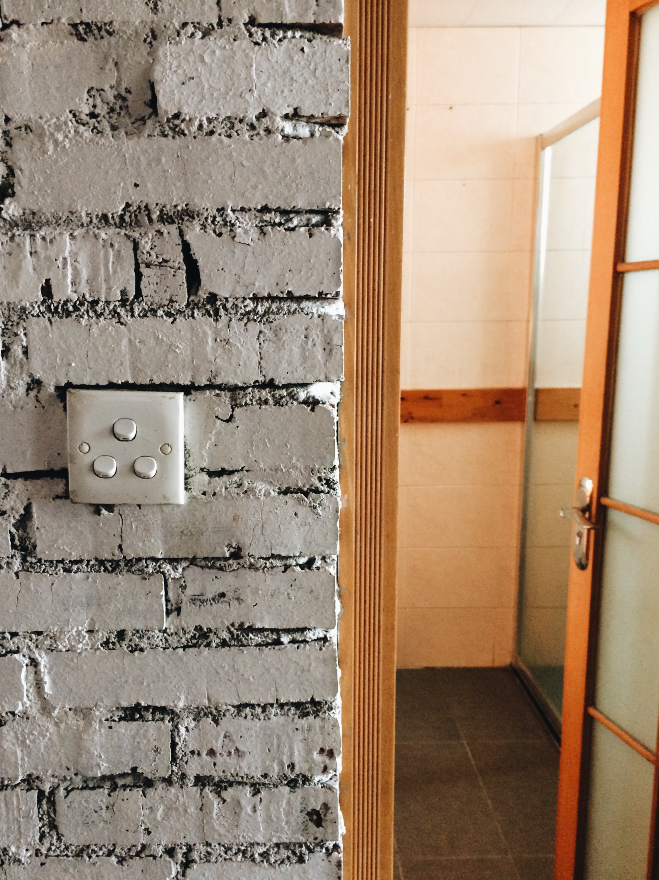 Bathroom light switches on the OUTSIDE of the bathroom.