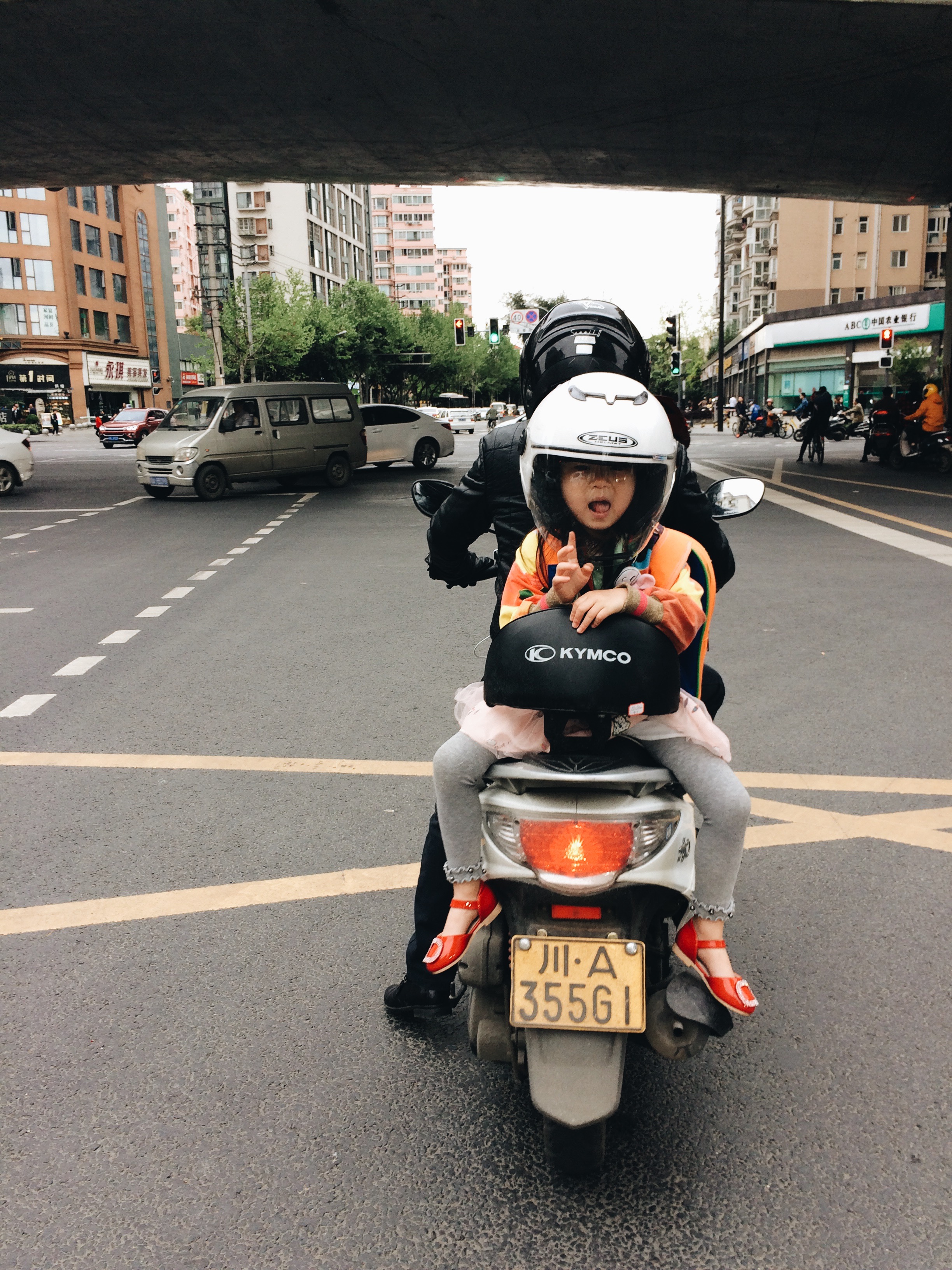 Friendly scooter waves.