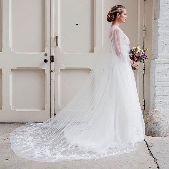 A romantic vision in an embroidered cape and layers of tulle, styled to perfection by the amazing team at @elitesecretsbridal. .
.
. 📸: @elyrosephotography
Gown: Charlotte gown and Cassidy cape by @marina_semone at @elitesecretsbridal
Hair: @shearsh
