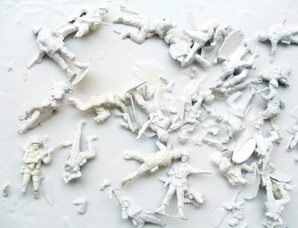 'TIDES' 2009 Plastic toy soldiers, PVA glue and spray paint on canvas 20 x 30 x 3 cm