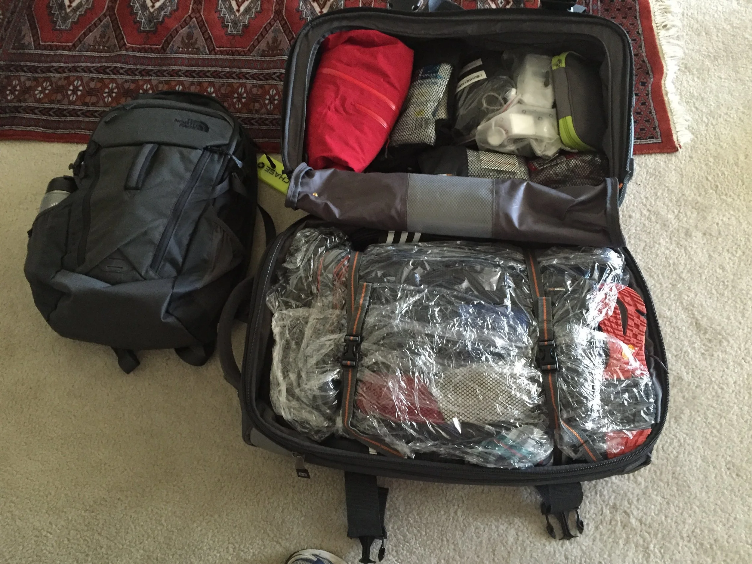 Franks packed rolling and carry on backpacks ready to go