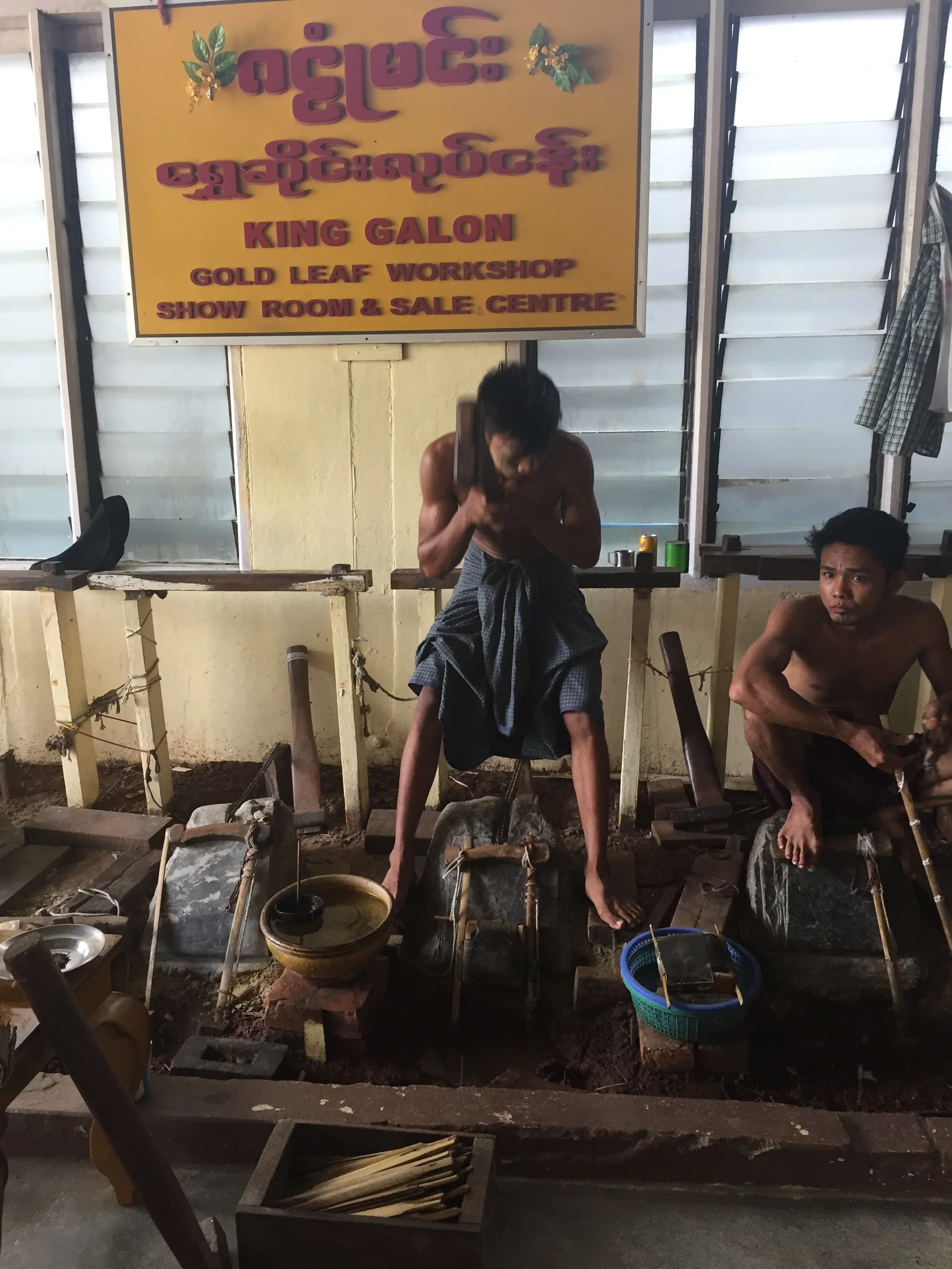 Pounding gold leaf by hand. The bowl of water is a type of timing when the smaller bowl sinks the pounding time is up