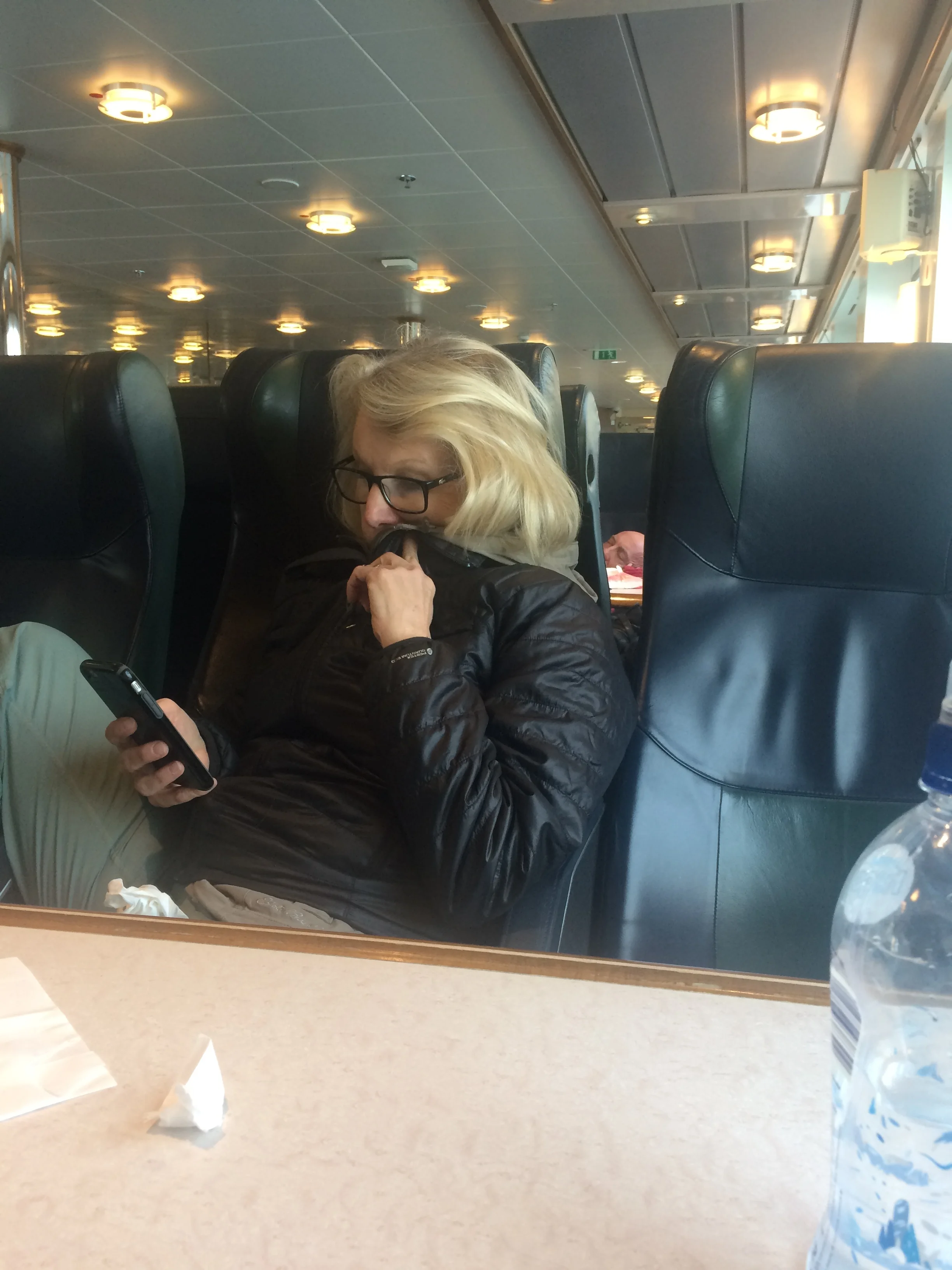 Janet on the boat, trying to keep distracted from the ride