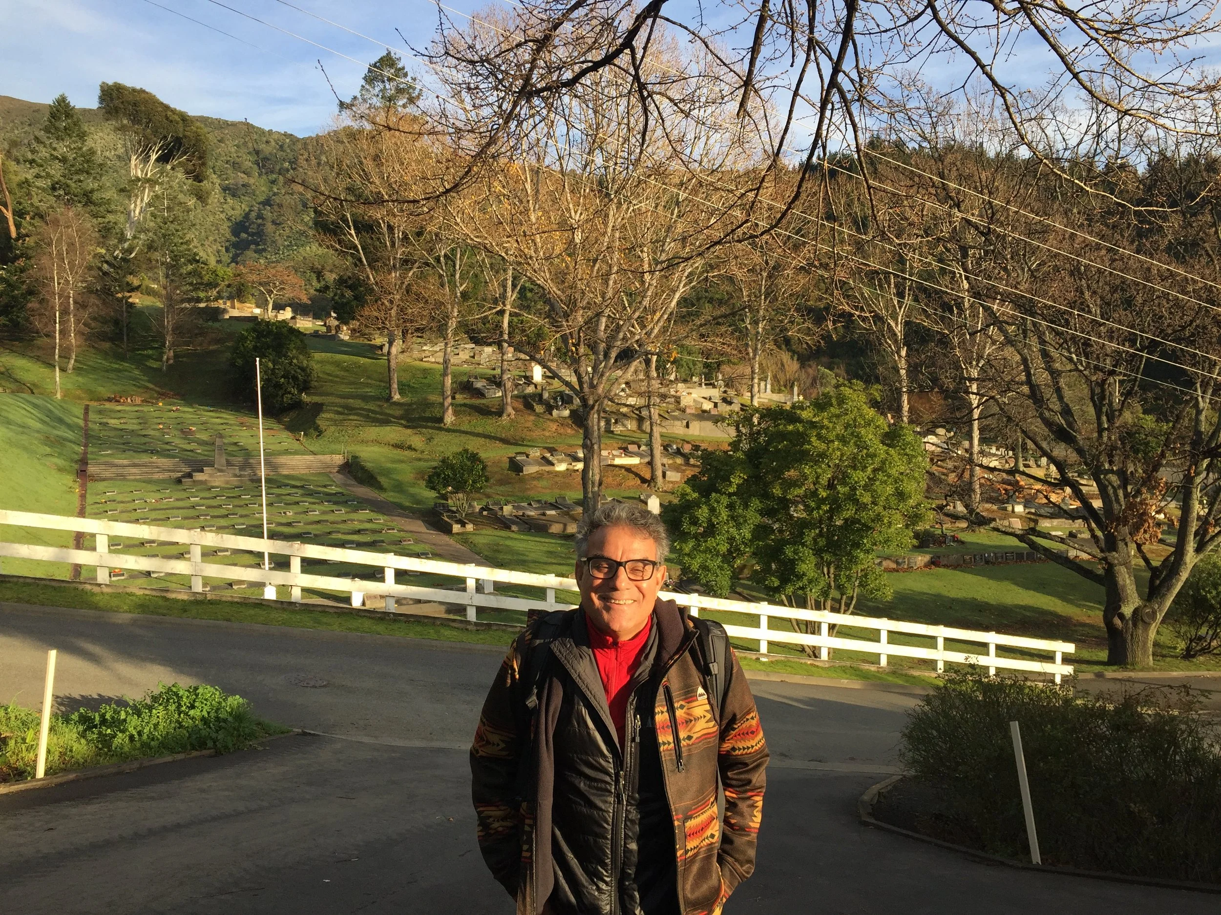 Frank with the graveyard behind him