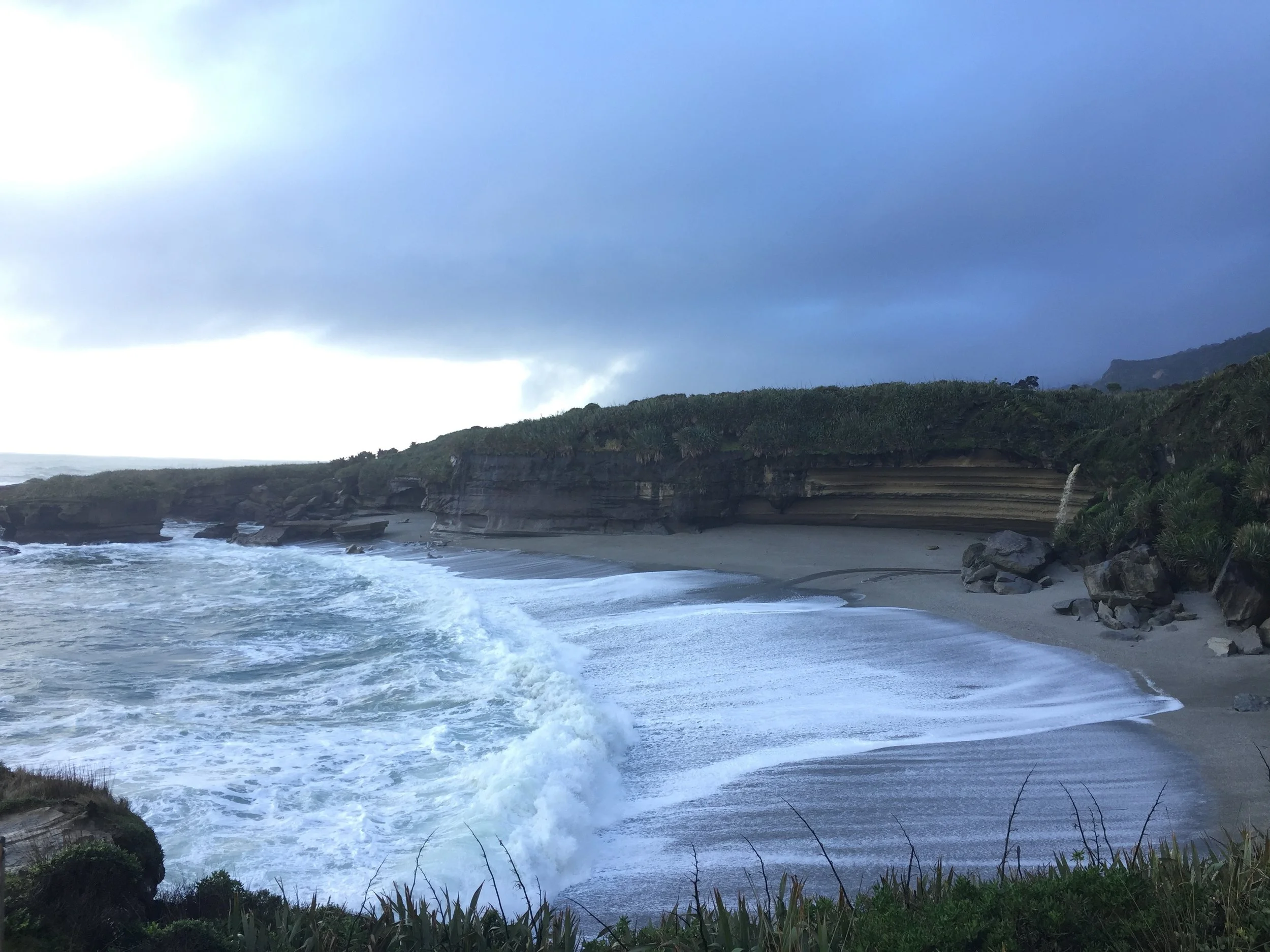 The beach, it is small rocks, not sand