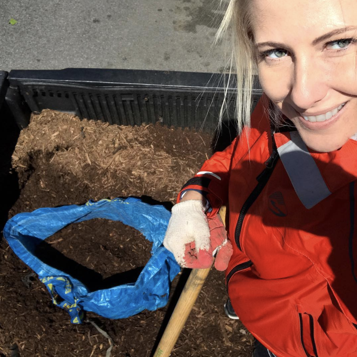 Filling up soil bags during a tree bed restoration project in 2017.