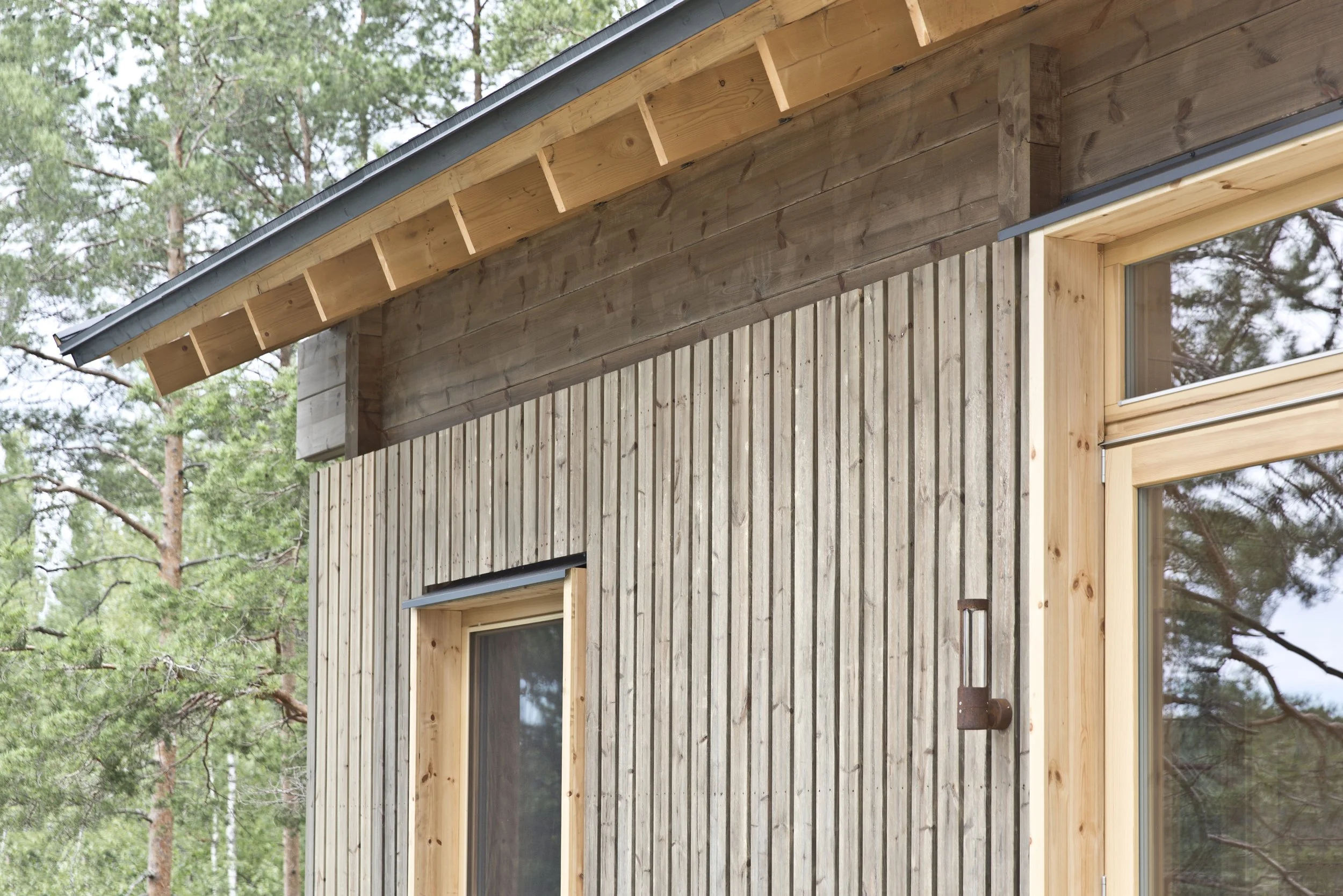 Iron Oxide Siding log cabin modern warm minimalism exposed wood