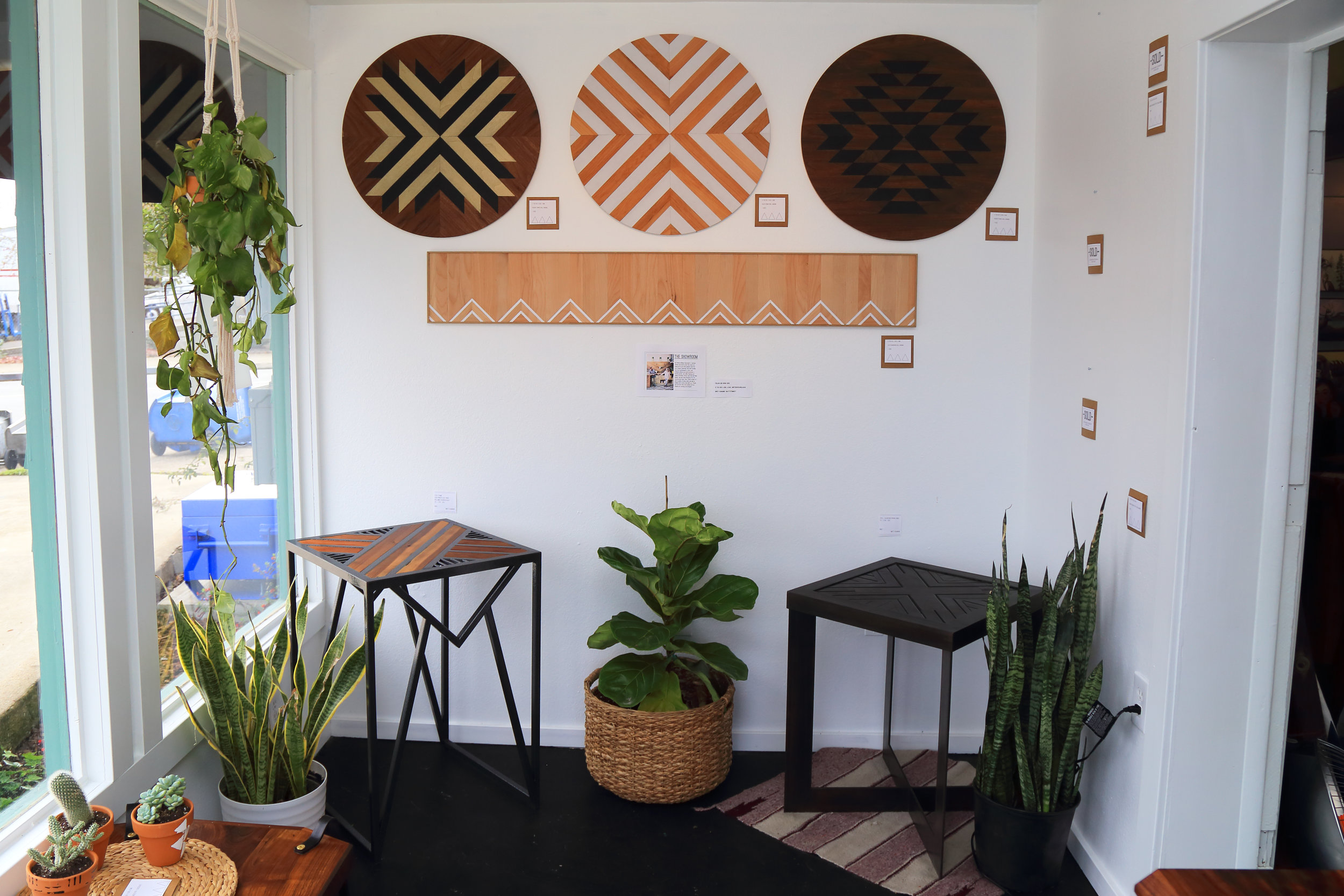 The showroom featuring work by If You Give a Girl a Saw and Mikey Gaumann