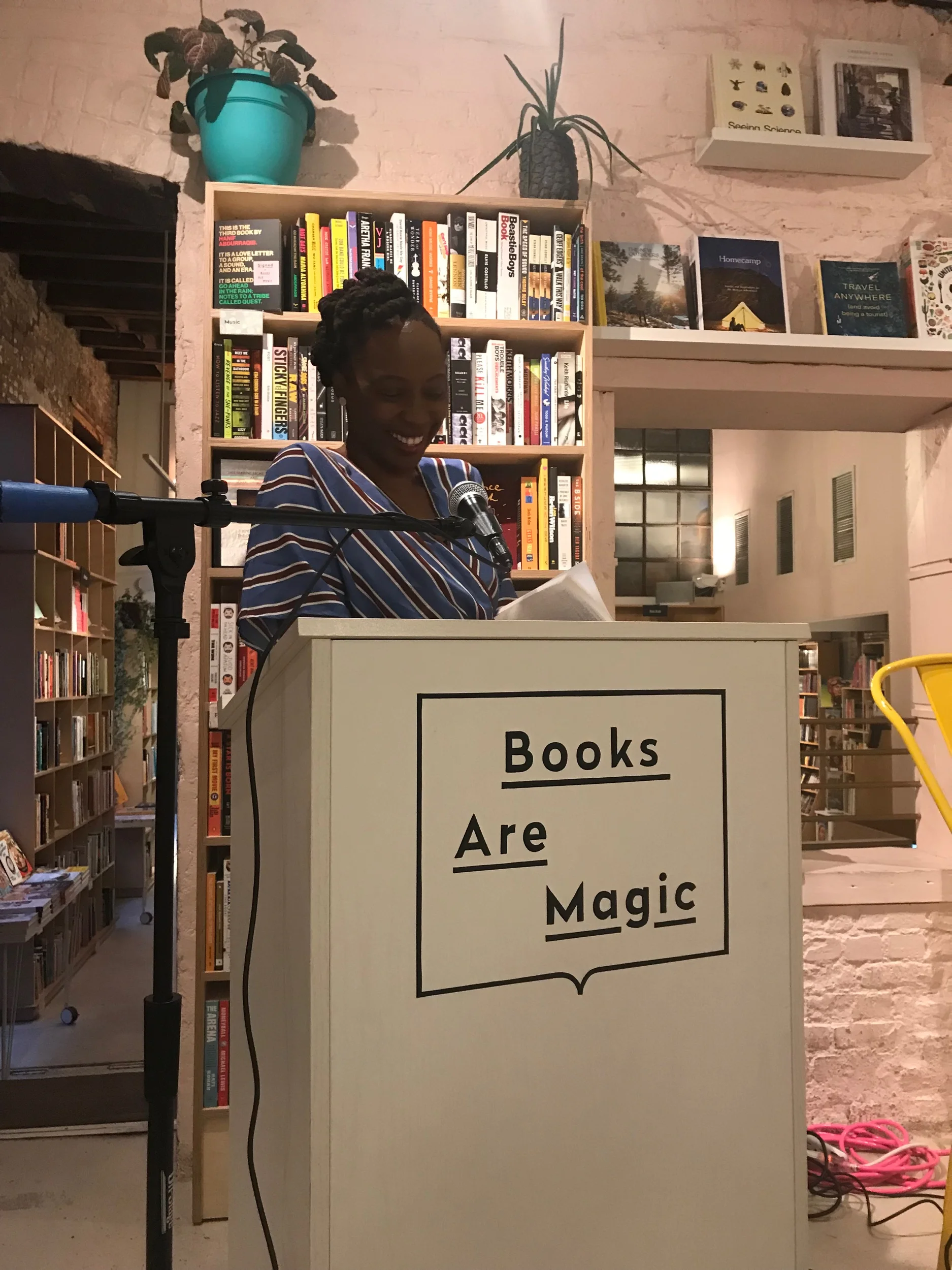 Author Bassey Ikpi reading a passage at Books Are Magic event in Brooklyn August 21st Photo Credit : Storm Jenkins