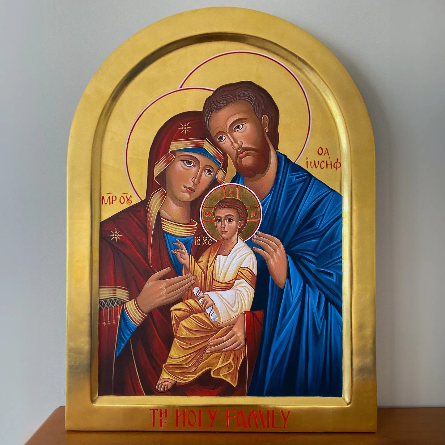 A recently completed commission of an icon of the Holy Family. The board was CNC routed out of plywood then coated with Italian gesso on an open weave cheese cloth base. Clay bole is applied to the areas to be gilded. The last image shows the composi
