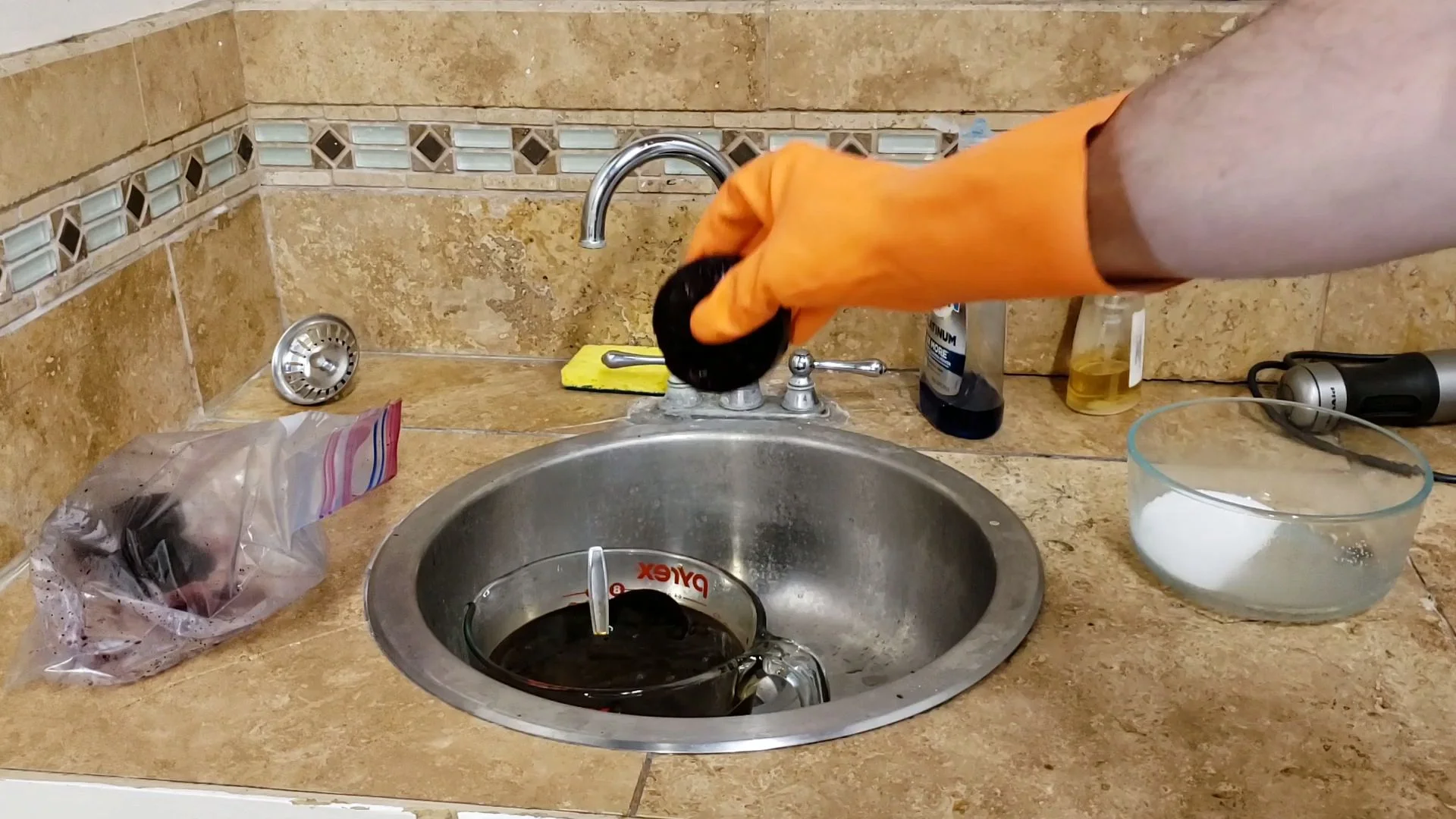 Ice pucks being melted into lye solution