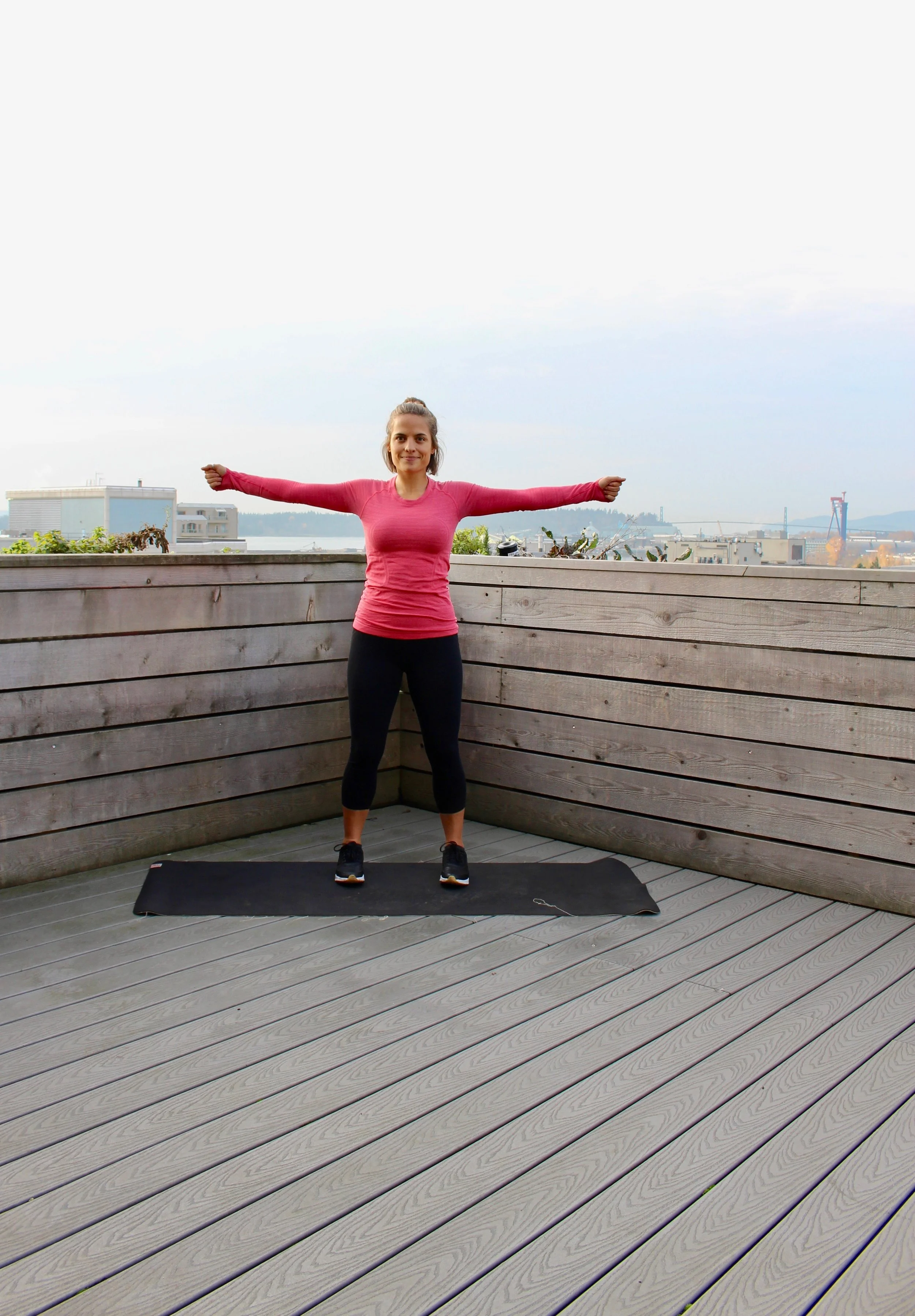 Exercise #3: Snow Angels. Click your fists together over your head, then move your arms laterally down to click again at the bottom. This picture shows me in mid-rep with arms out laterally. This should be quick and make sure you click your fists together to ensure full range of motion.