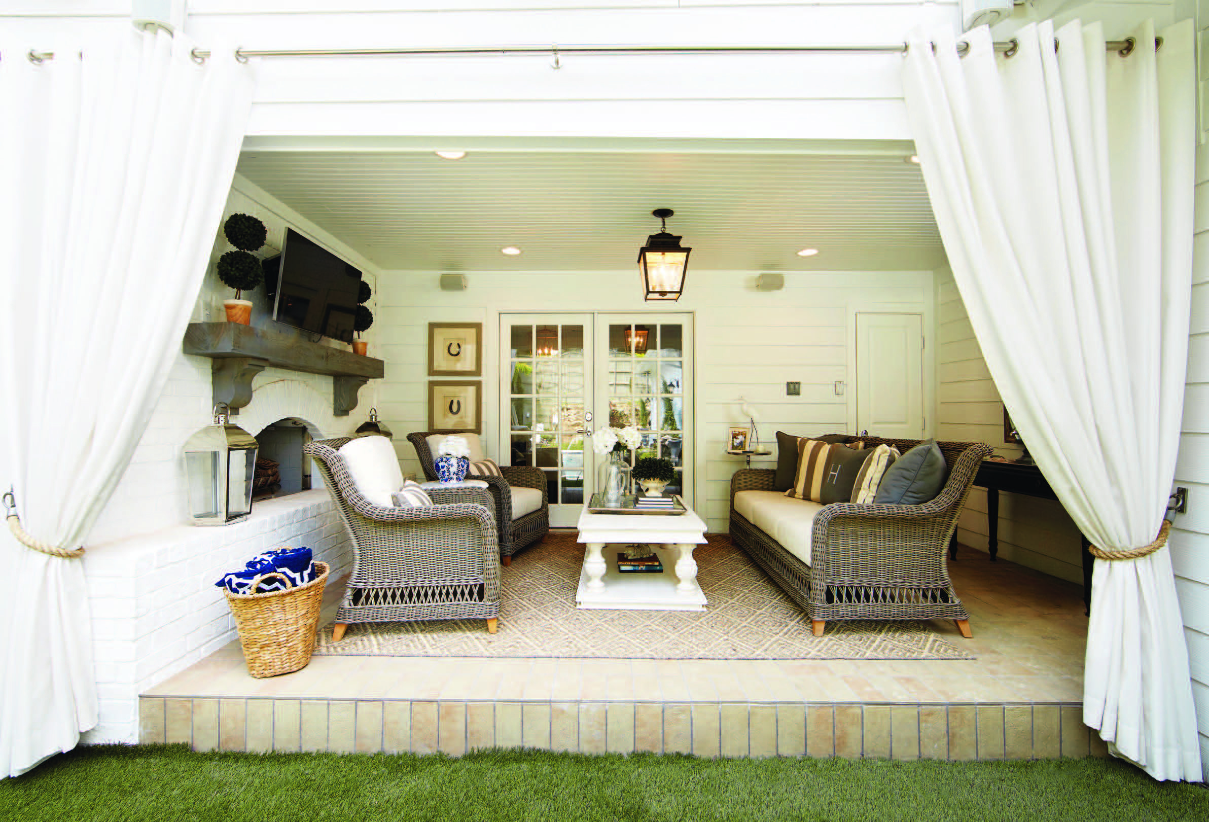 A wall was removed to transform this interior room into an indoor/outdoor cabana space that the family uses year round.