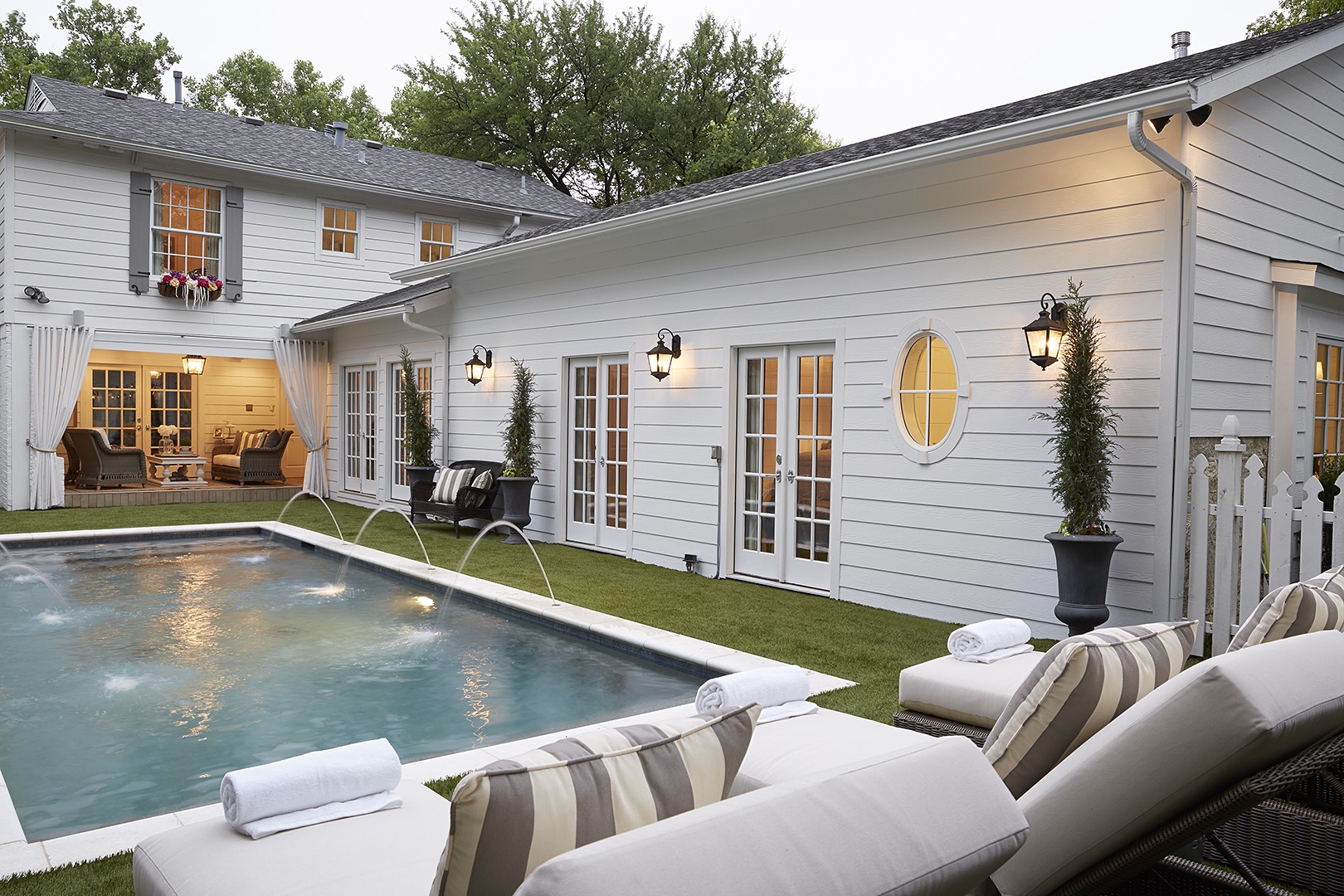 Emily and her husband updated their backyard by removing a deck, adding a pool and installing artificial grass. The renovated master suite has French doors that lead to the pool.