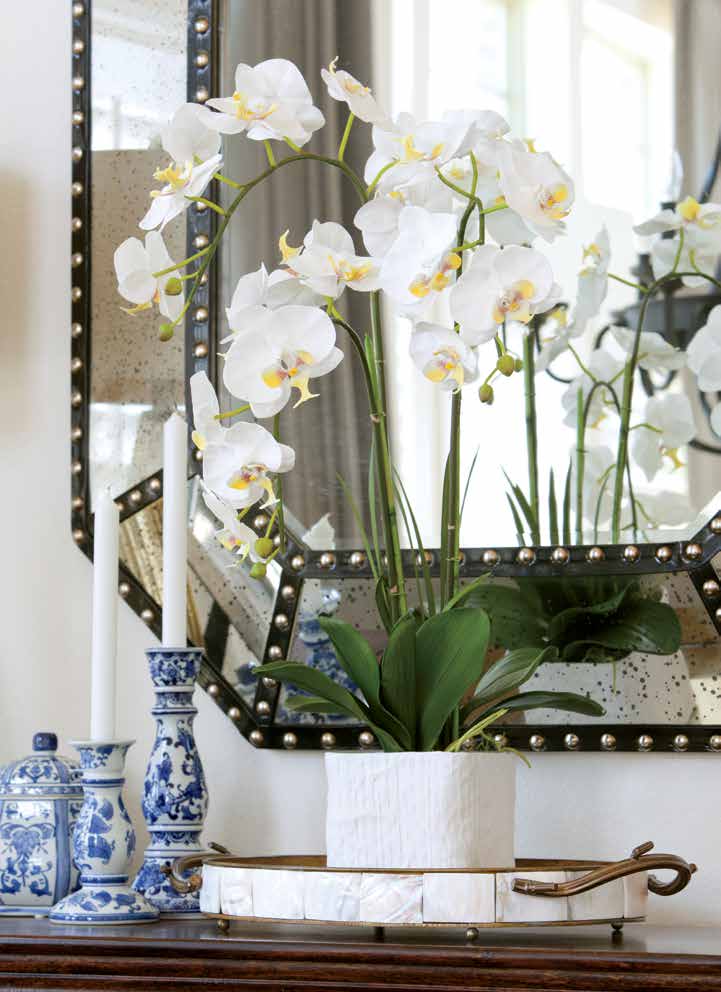 A freestanding island once sat where designer Emily Hewett and her family now enjoy meals. When the previous owners took it with them, Emily decided to hang a chandelier and, in true farmhouse fashion, embrace an eat-in concept. She then lowered the existing serving bar to suit barstools and 3-year-old twins Beckham and Stella, topping the new family friendly island with Calacatta Borghini marble.