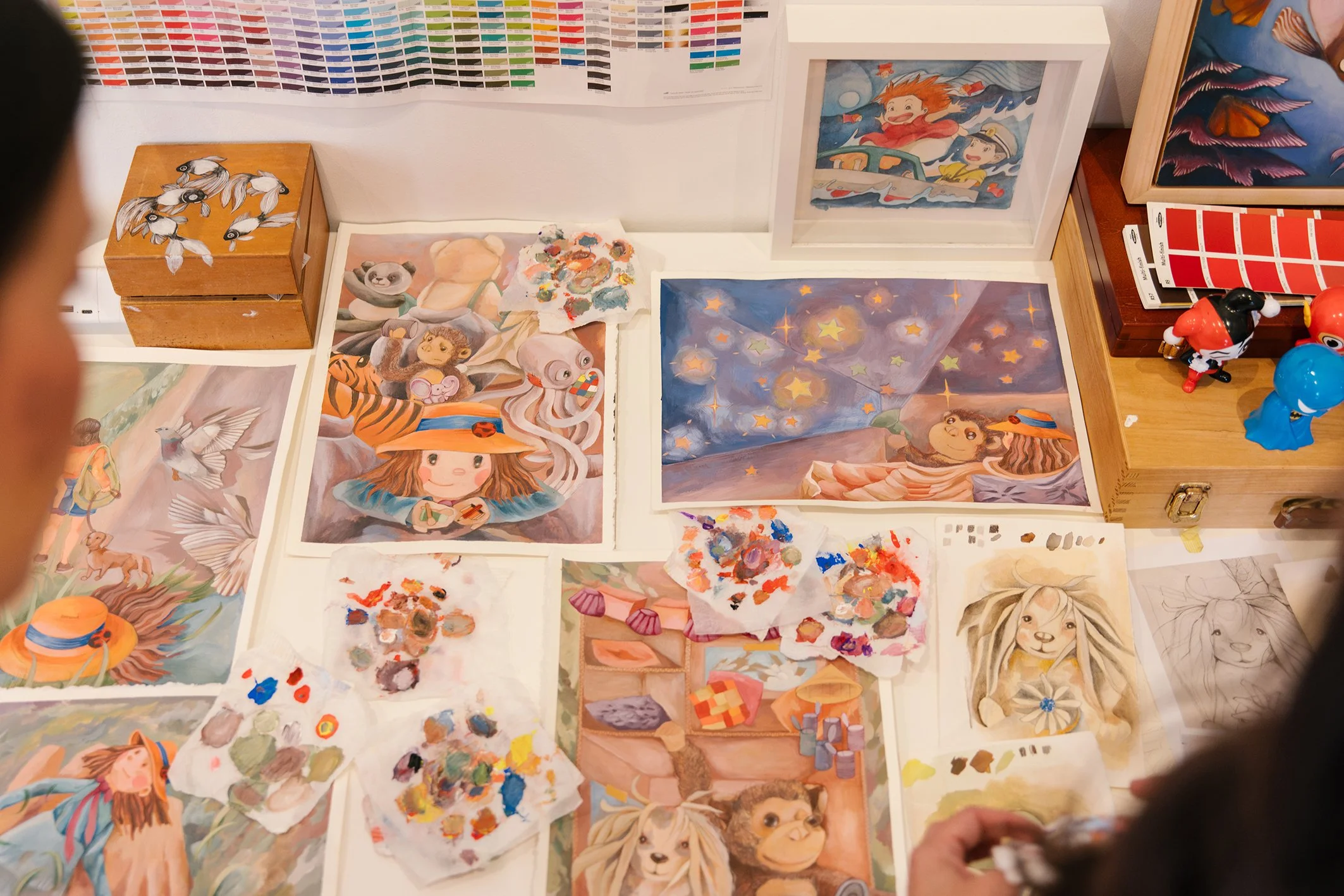 Painted spreads on desk for Finders Keepers the Book by Madame Ng and Christina Huynh