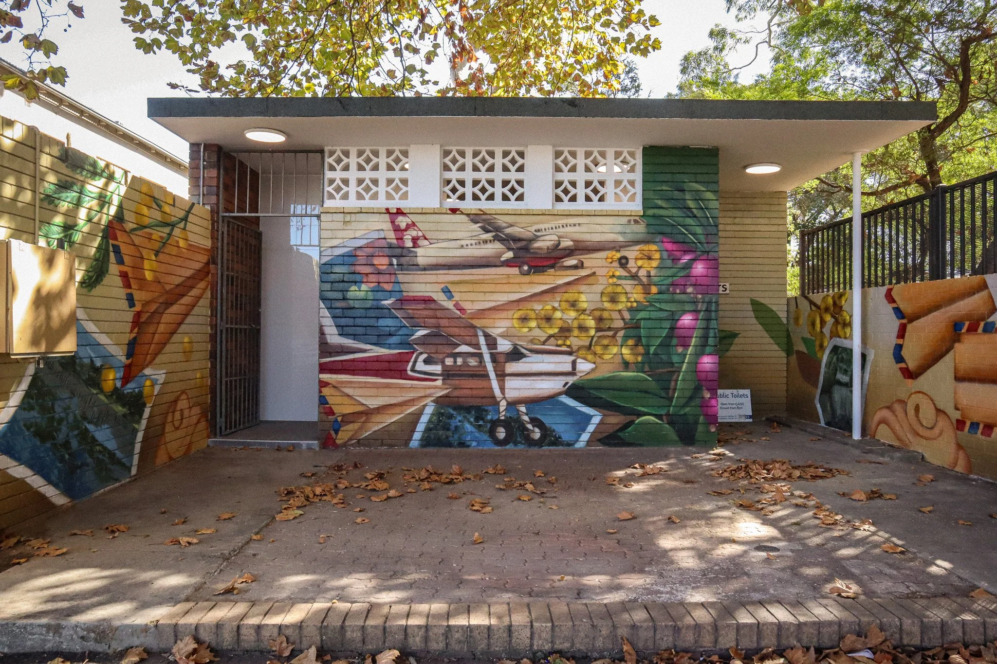 mural artwork of planes on amenities block