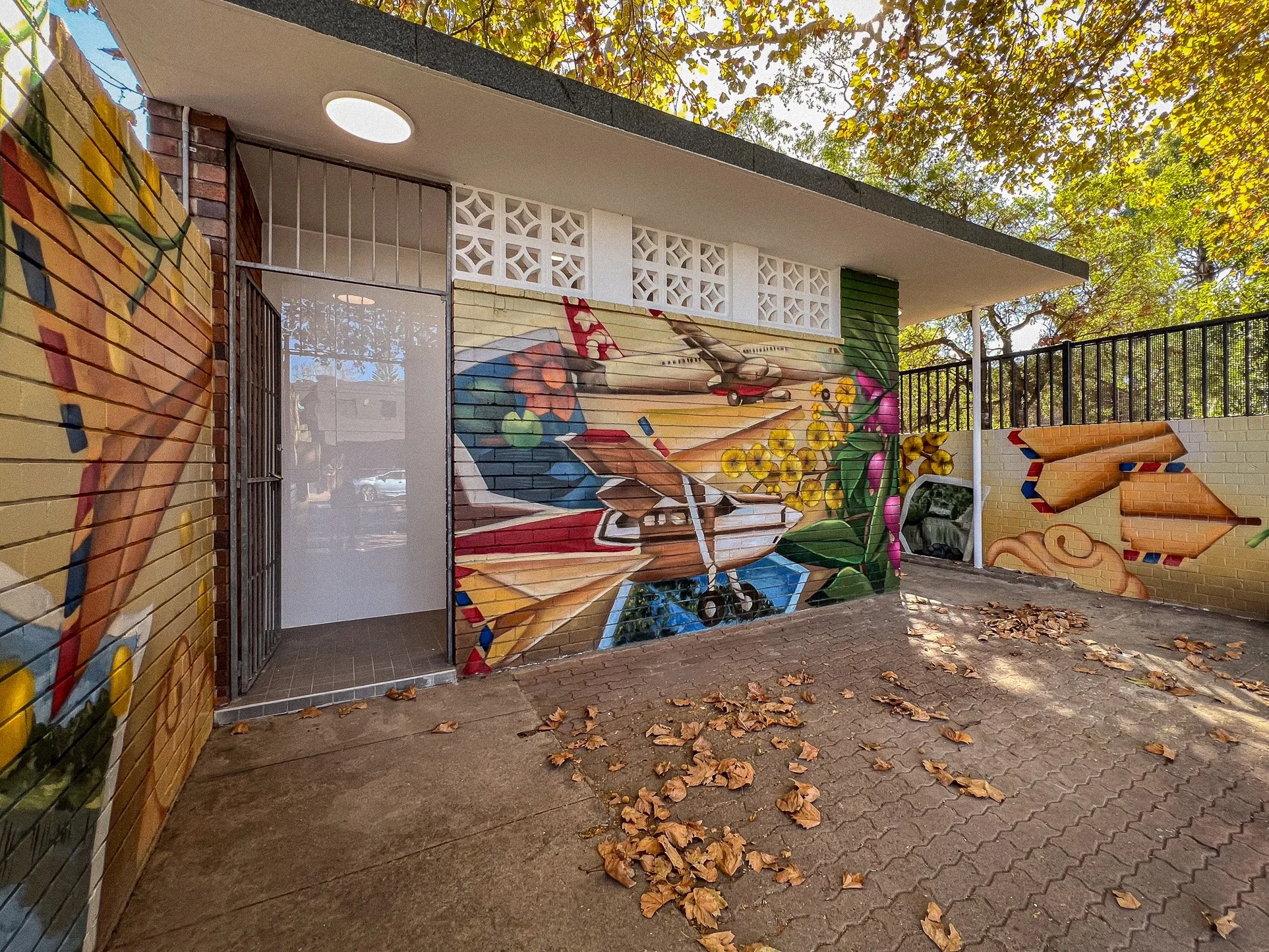 mural artwork of planes on amenities block