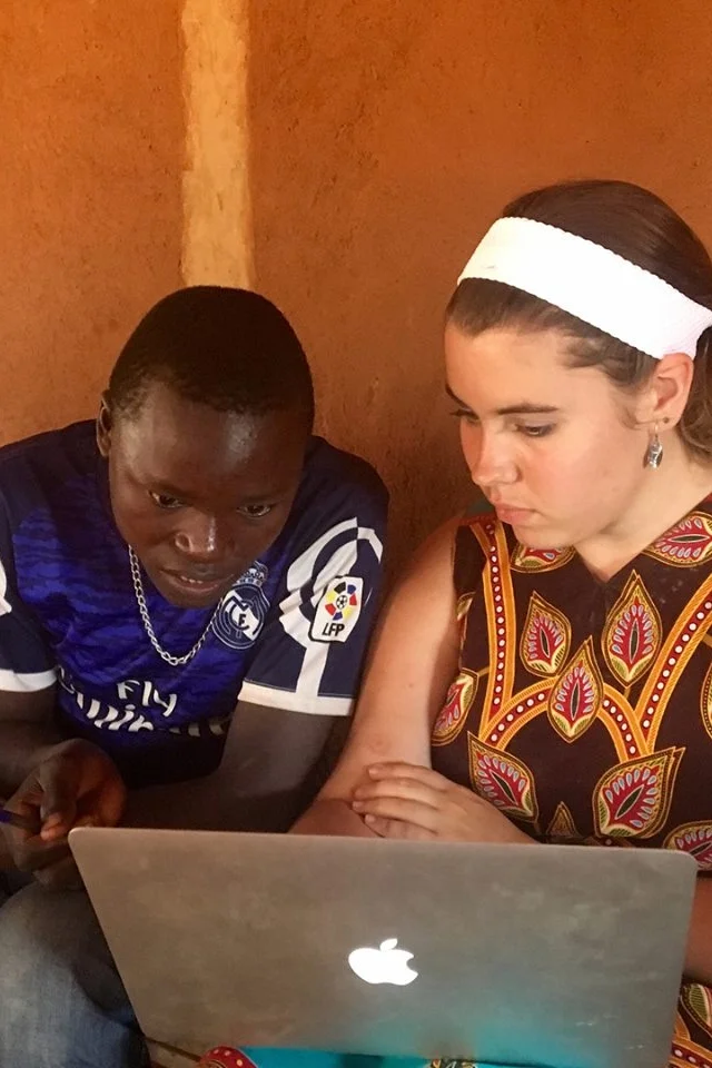 I often feel embarrassed taking laptops or fancy cameras to villages, but they're also tools for assessing literacy and empowering agricultural development.