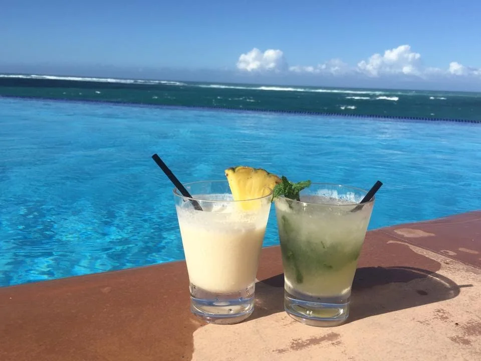 Cocktails poolside. Cheers! 