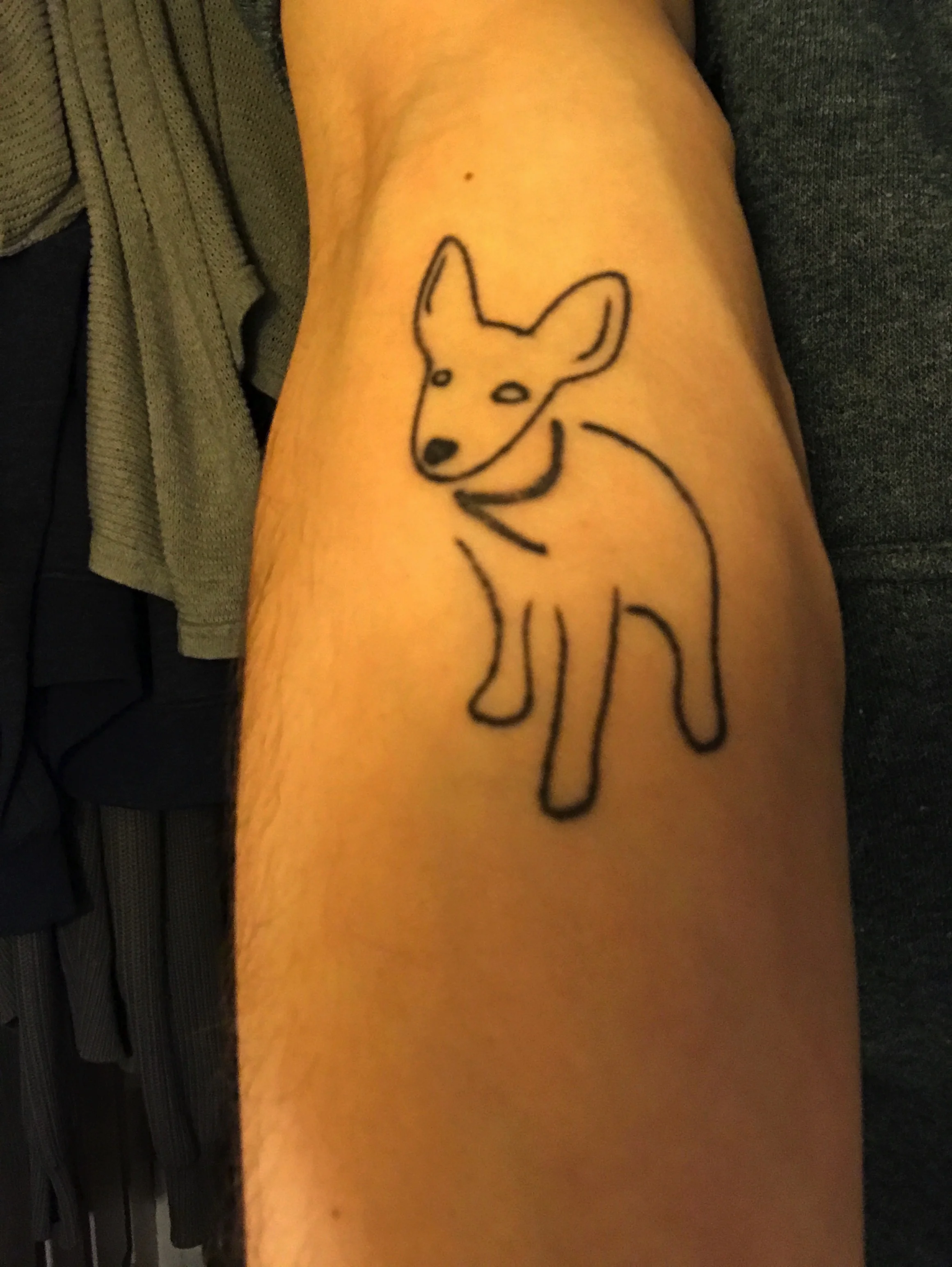 The tattoo. Illustrated by Katie Himmel, the author's wife, half a decade before the author knew Katie and Eddie. It's now the spirit/emotional support animal permanently engraved into his being.