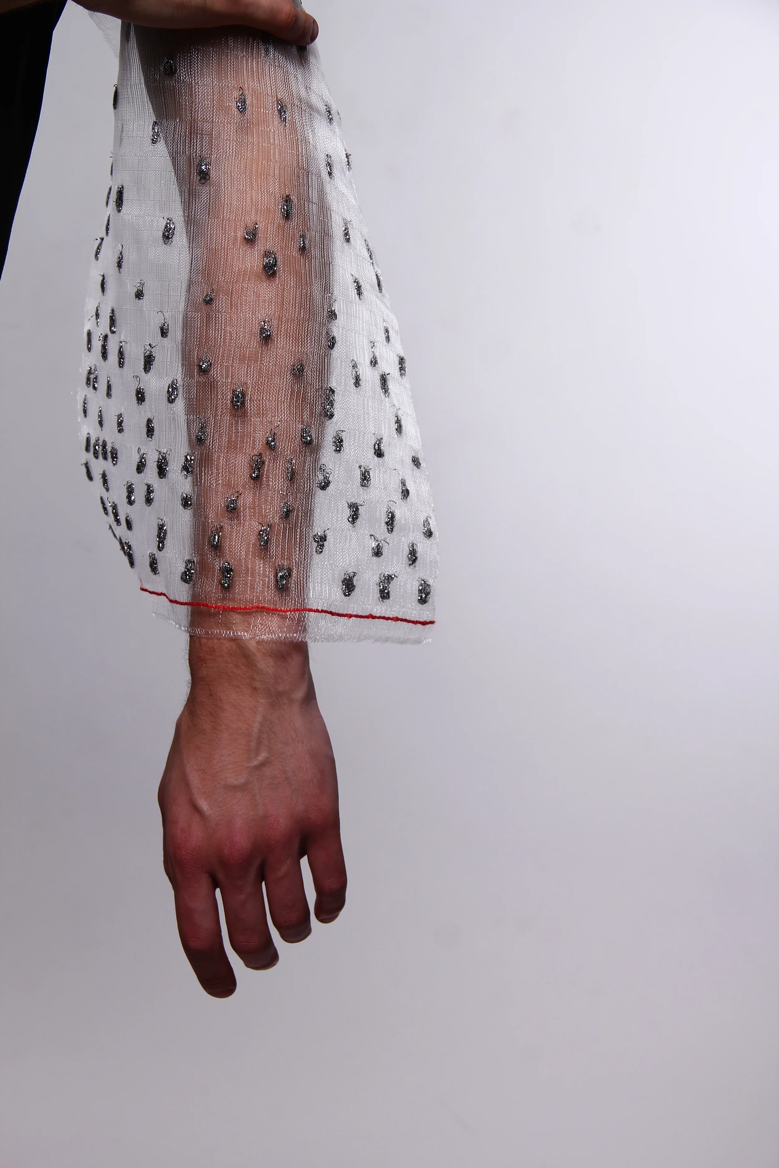 Transparent polyester loom with 'beading' made from metal scourer / transparency + tactility