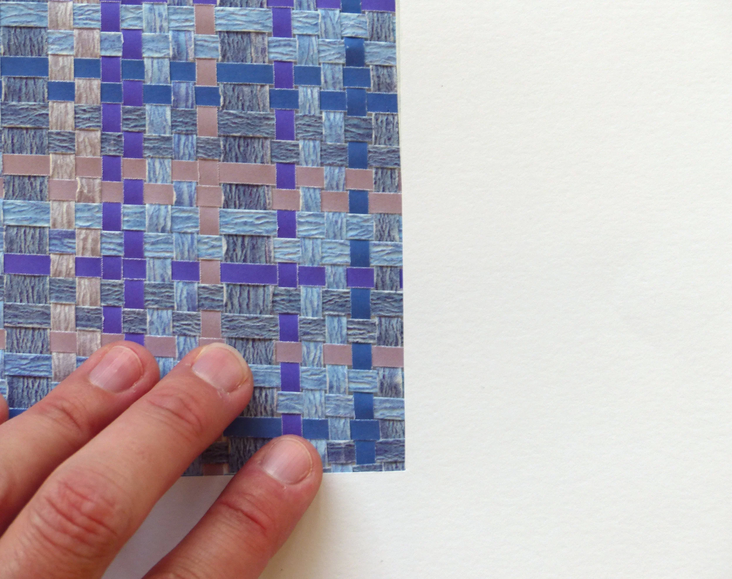 Hand to understand size of the woven paper piece