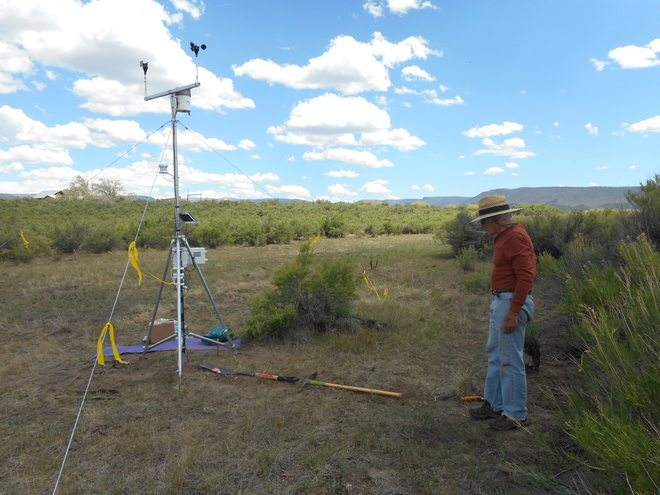 Meteorologist Bob Grossman prepares connection to soil temperature and moisture instruments.