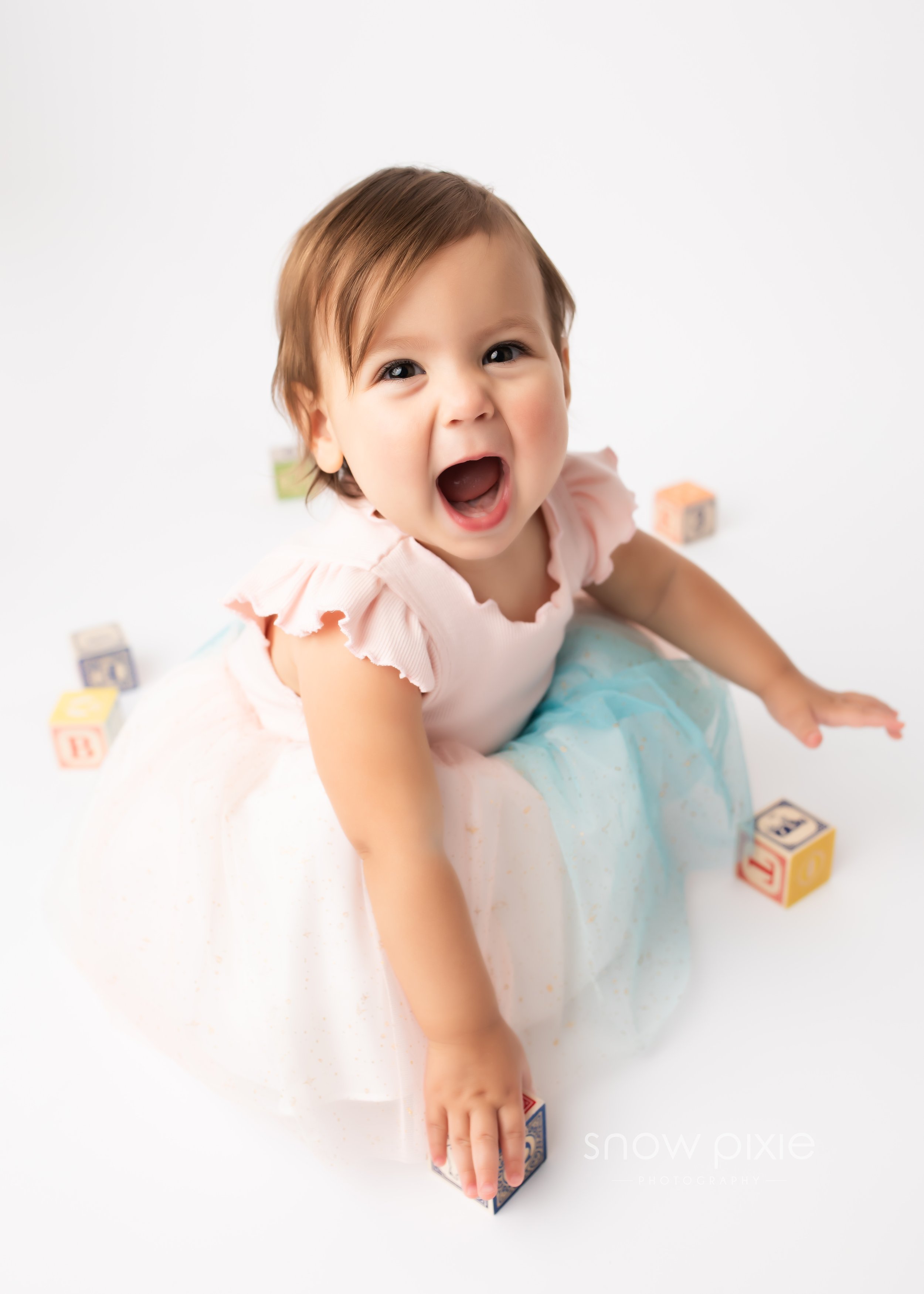 Baby girl during baby milestone session.  One year image!